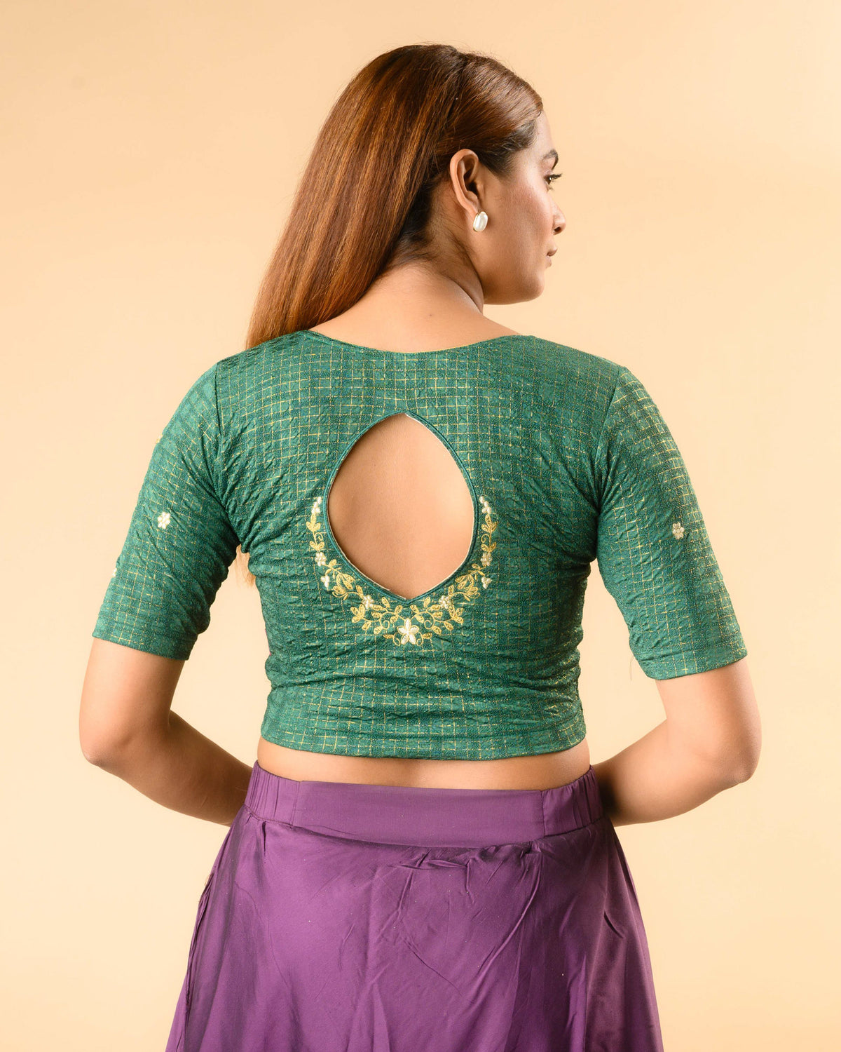 Yamini bottle green blouse with teardrop keyhole and gold zari floral border by Advi - back