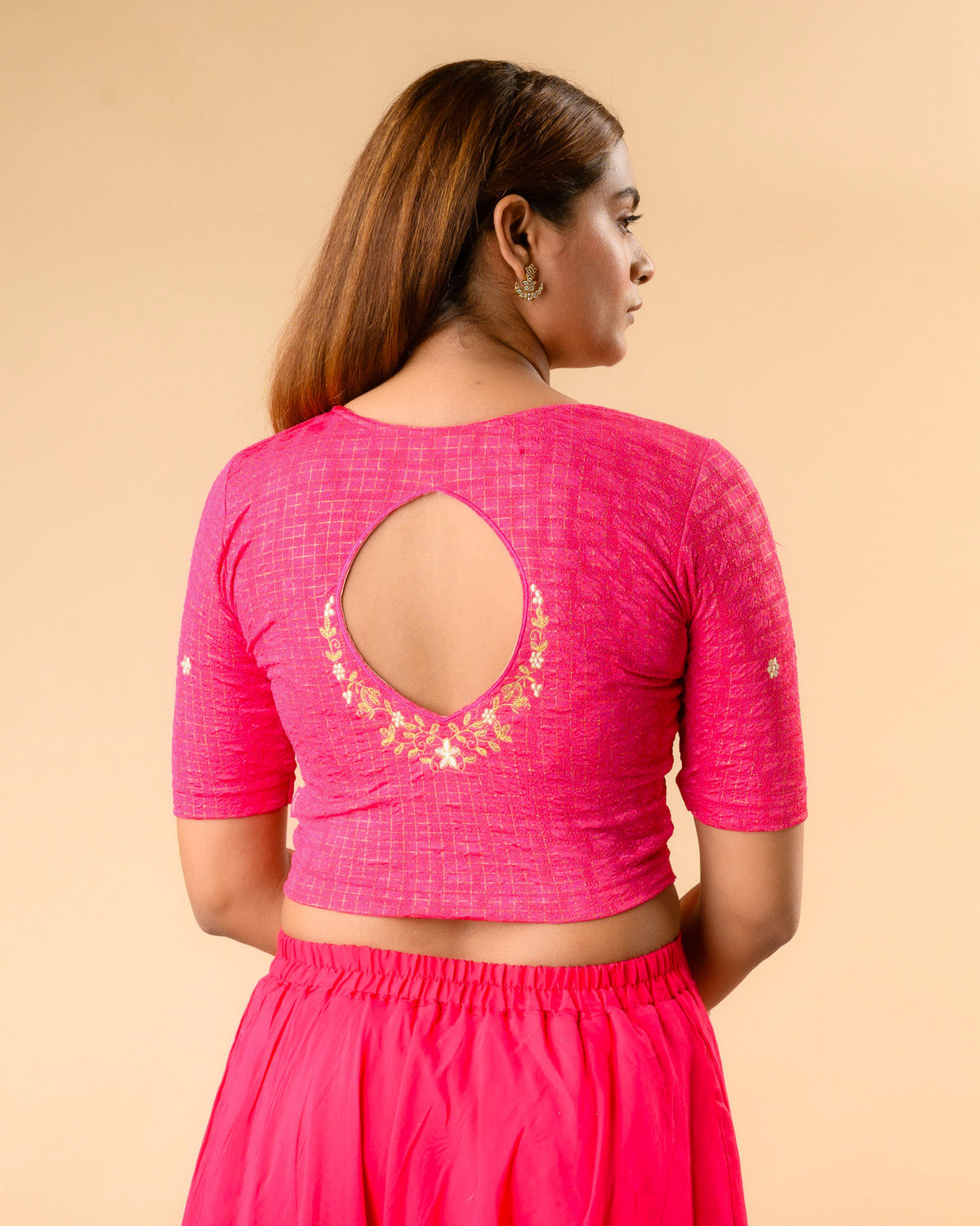 Yamini fuchsia rani blouse with teardrop keyhole and gold zari floral border by Advi - back