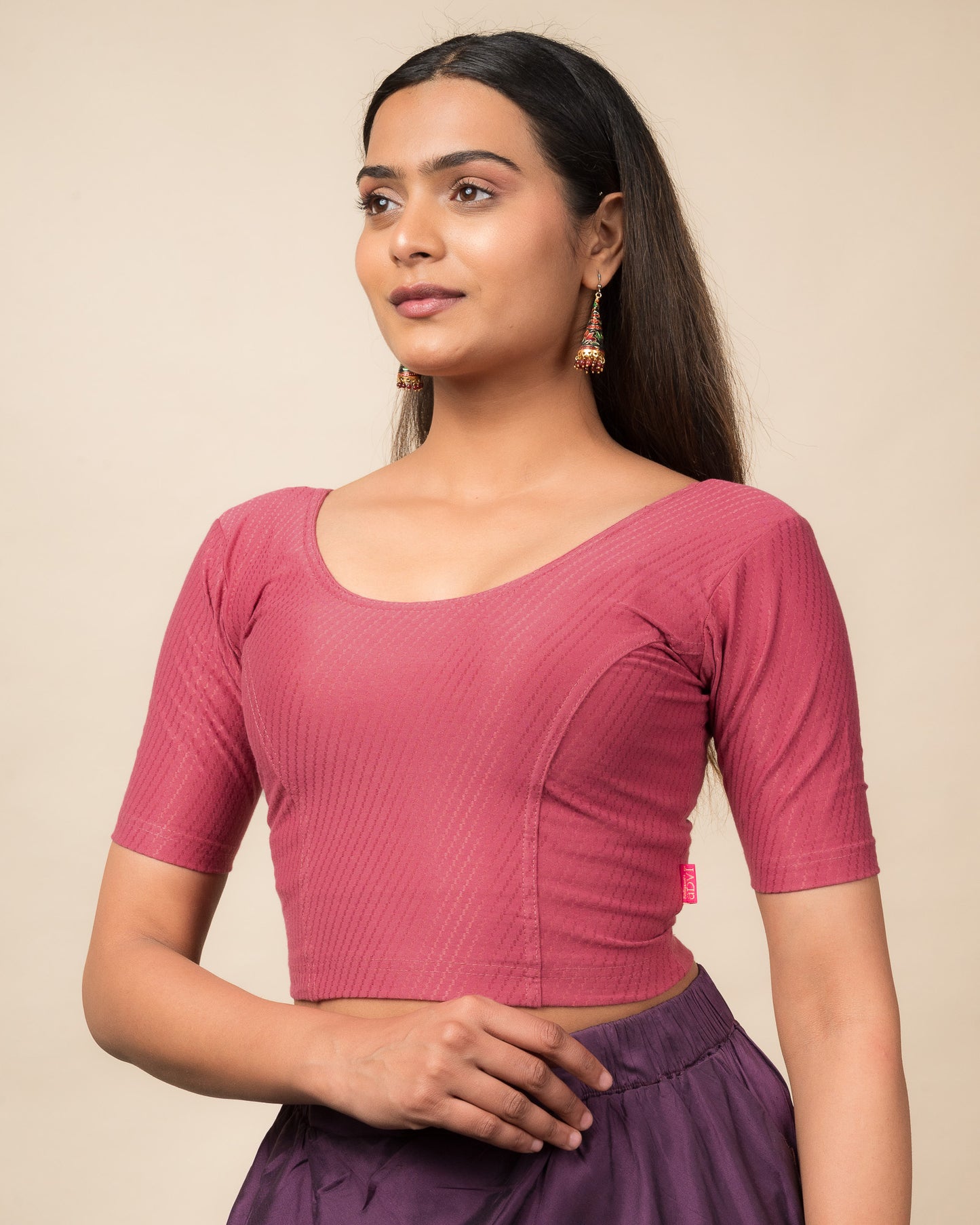 Side profile highlighting sleeve length and silhouette