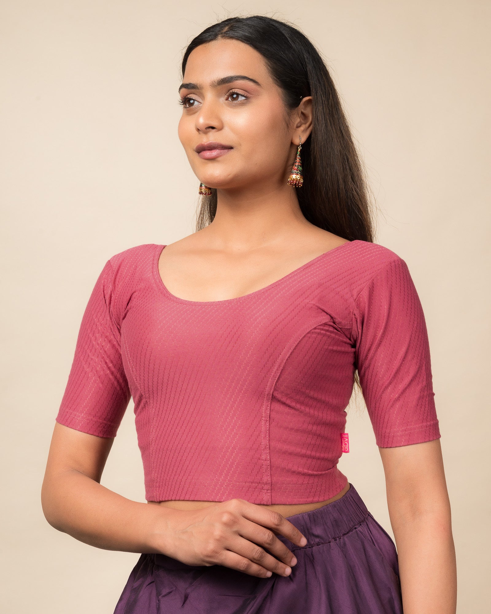 Side profile highlighting sleeve length and silhouette