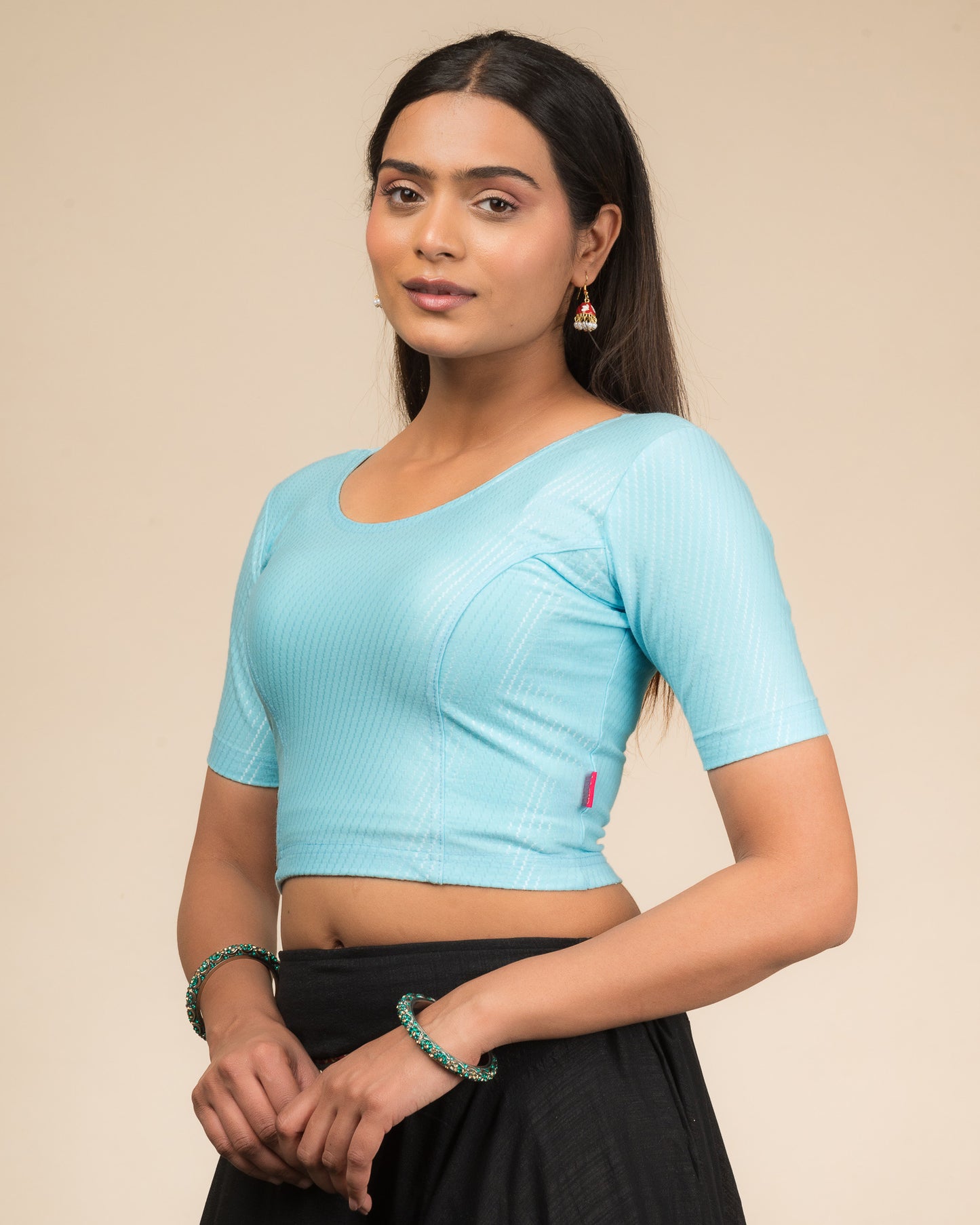 Side profile highlighting sleeve length and silhouette