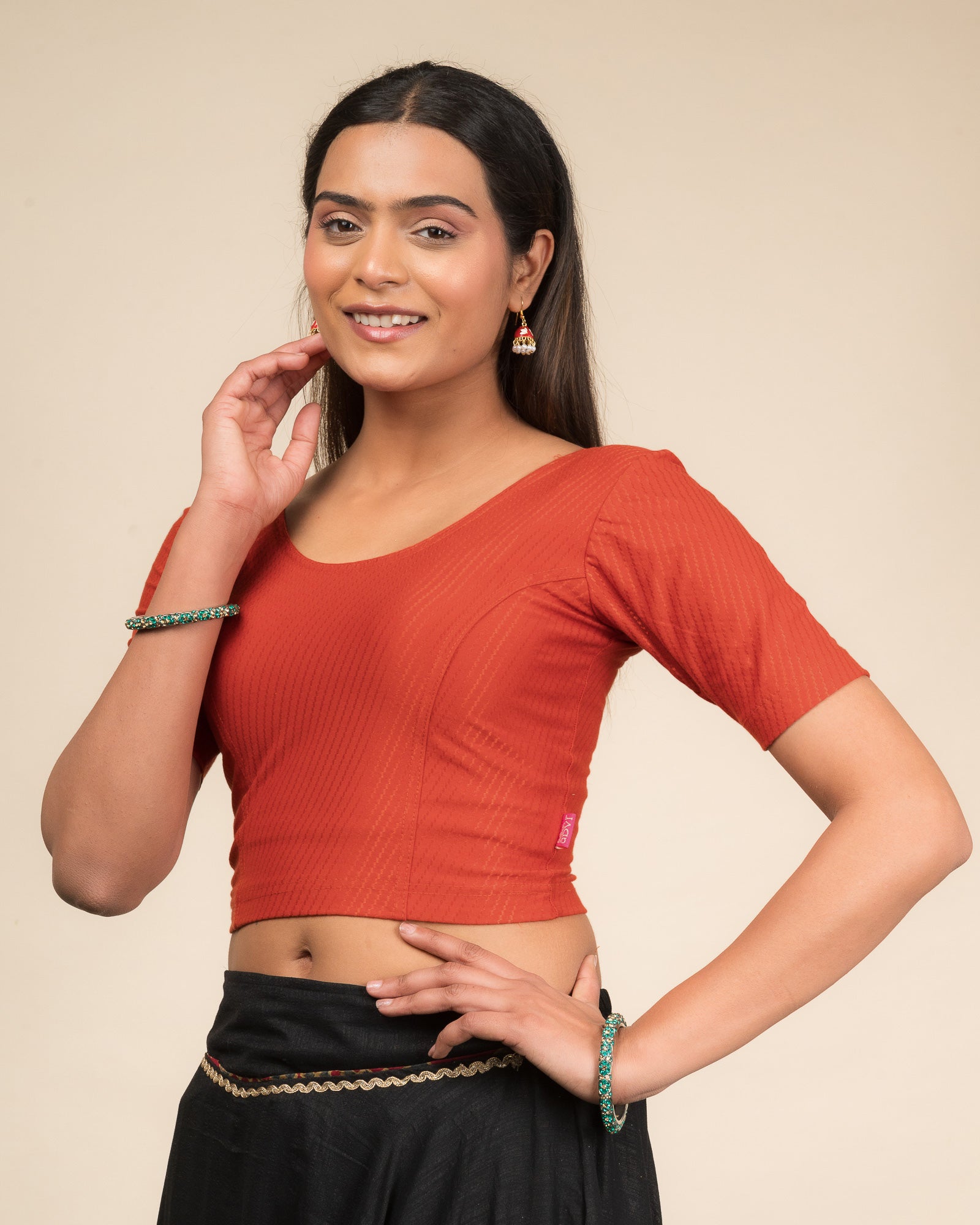 Side profile highlighting sleeve length and silhouette