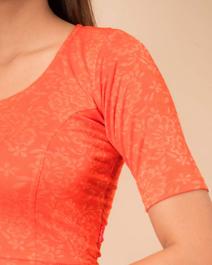 Ambreen Orange Frill Jacquard Blouse with Fancy Back Cut by Advi