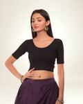 Radha Black Jacquard Blouse with Embellished Potli Back by Advi