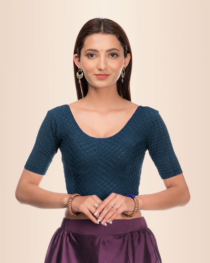 Model wearing a stretchable blouse with metallic zig‑zag stripes, elbow sleeves, and round neckline