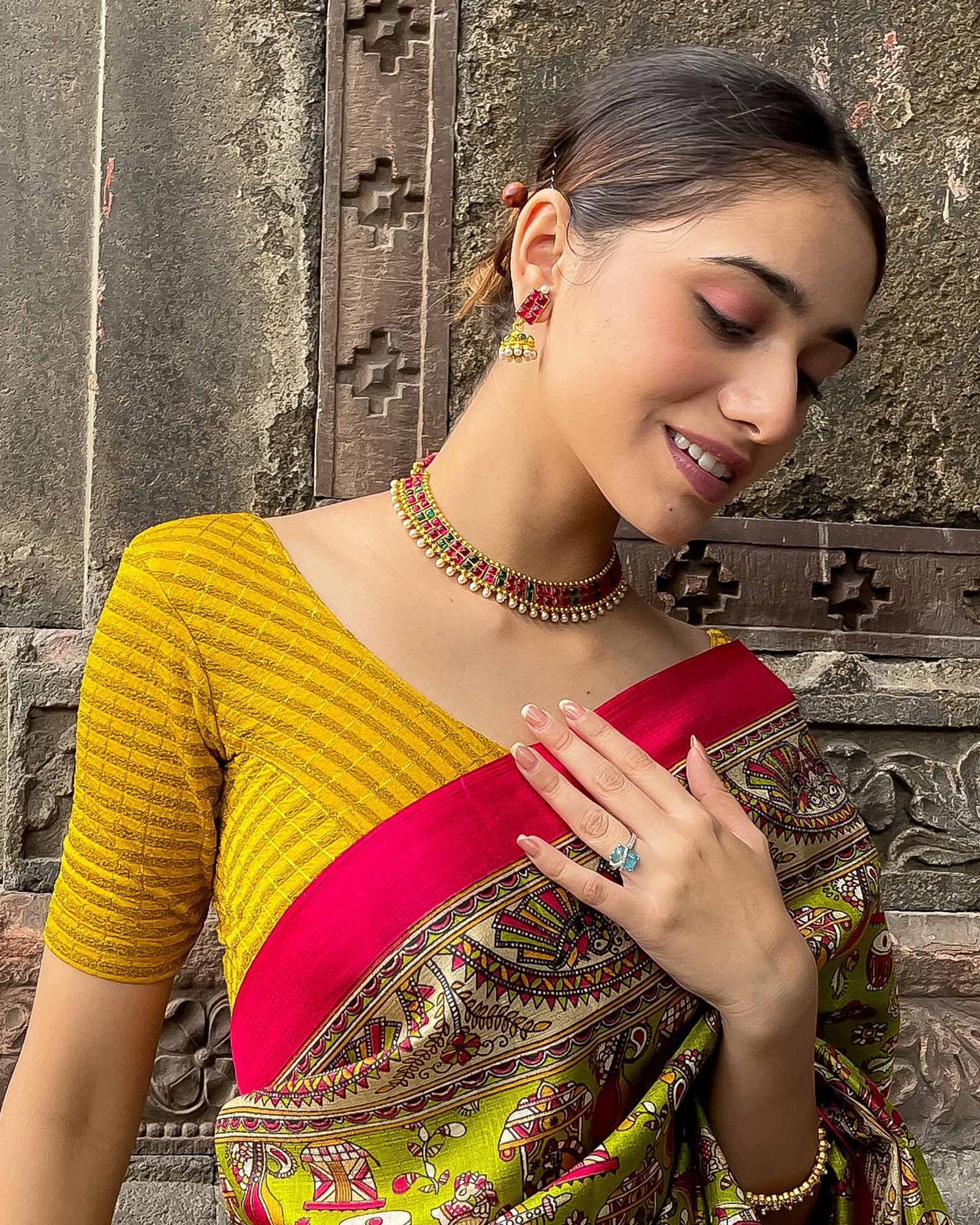 Model pairing the blouse with a saree for a bold, festive look