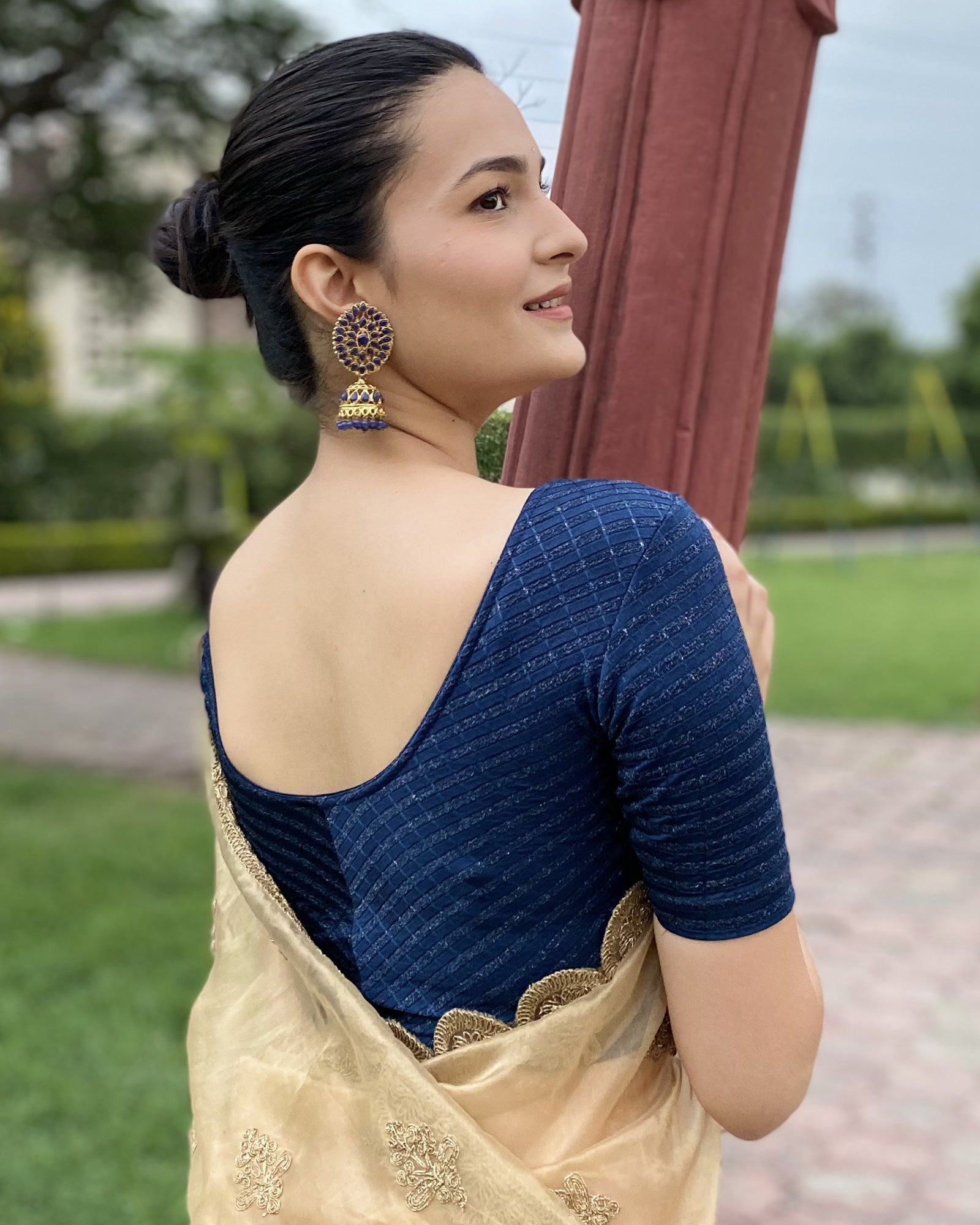 Model pairing the blouse with a saree for a bold, festive look