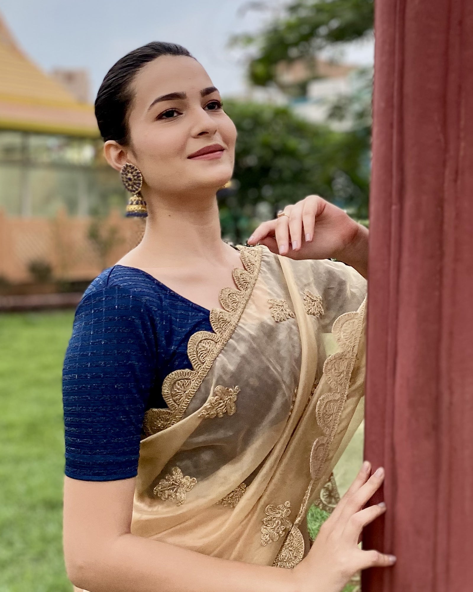 Model pairing the blouse with a saree for a bold, festive look