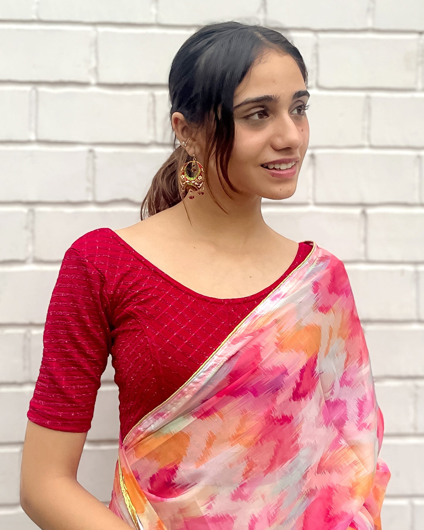 Model pairing the blouse with a saree for a bold, festive look