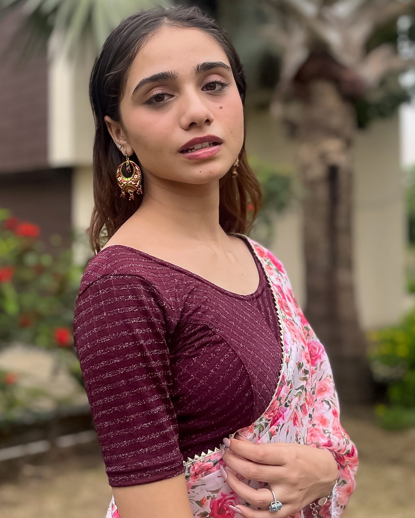 Model pairing the blouse with a saree for a bold, festive look