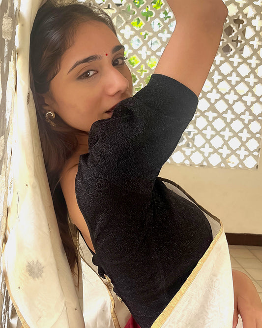 Model pairing the blouse with a saree for a polished festive ensemble