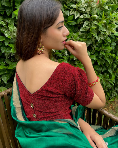 Model pairing the blouse with a saree for a polished festive ensemble