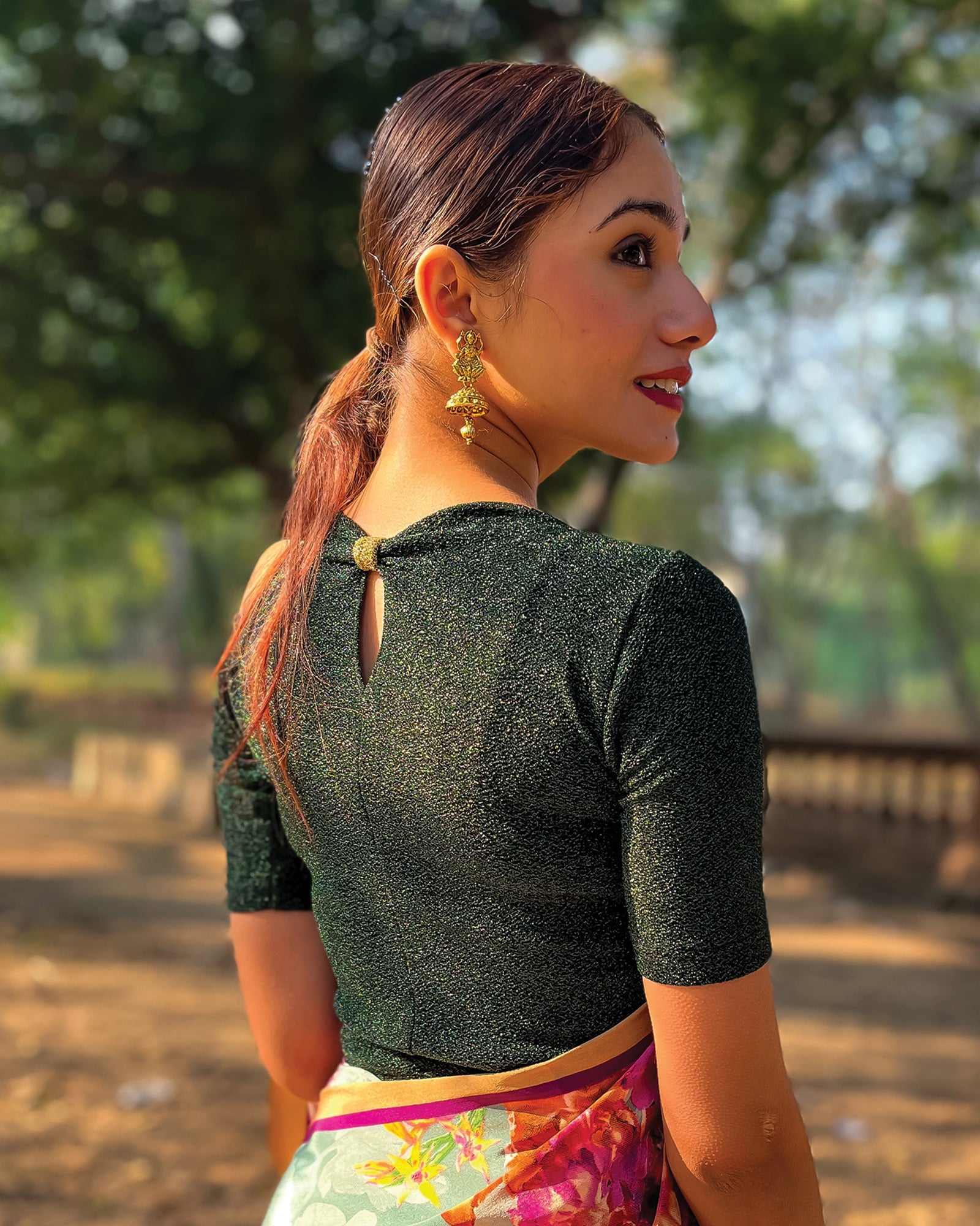 Model pairing the blouse with a saree for a chic festive look.