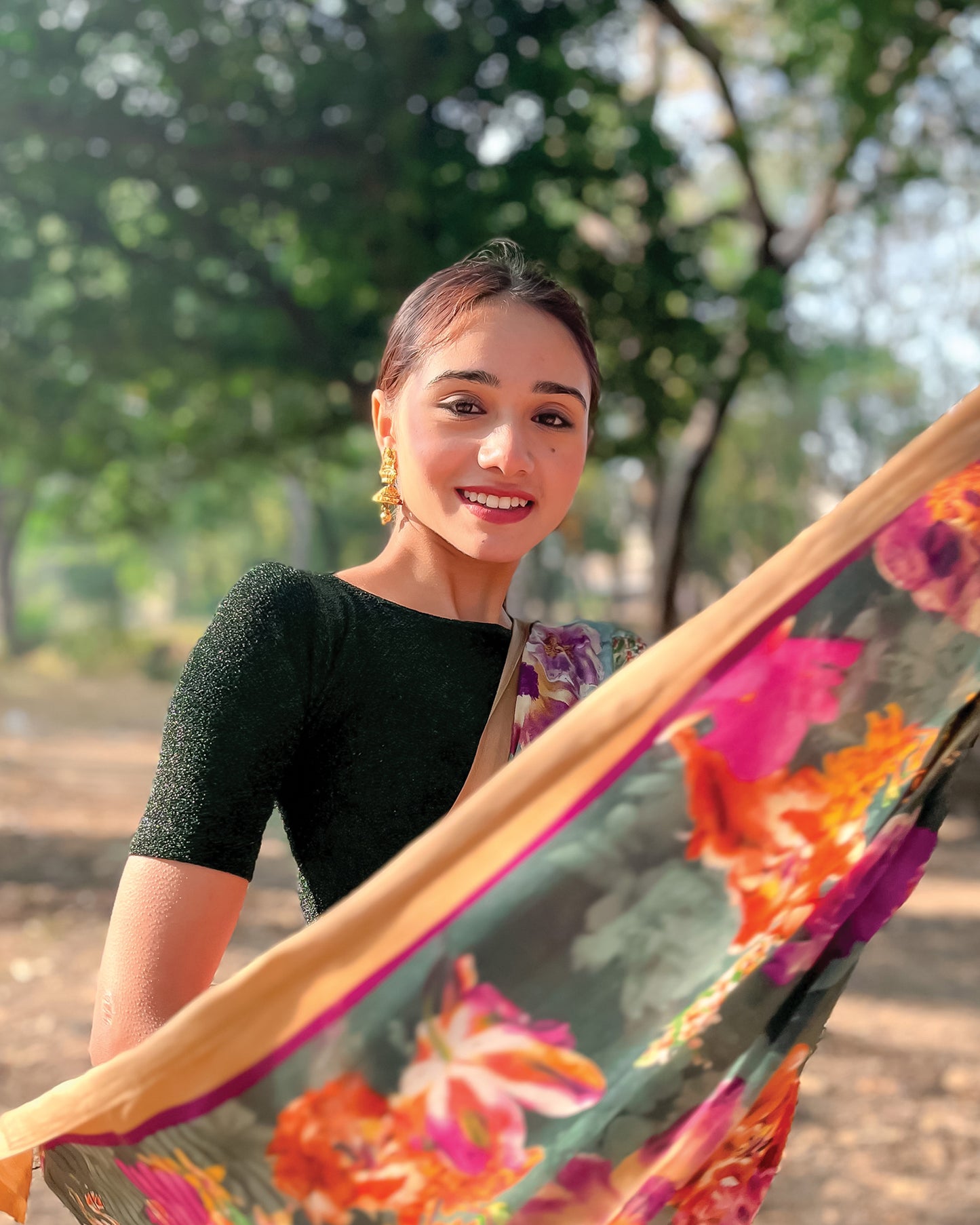 Model pairing the blouse with a saree for a chic festive look.