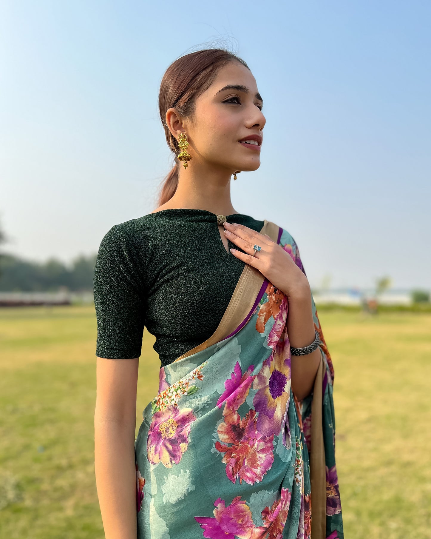 Model pairing the blouse with a saree for a chic festive look.
