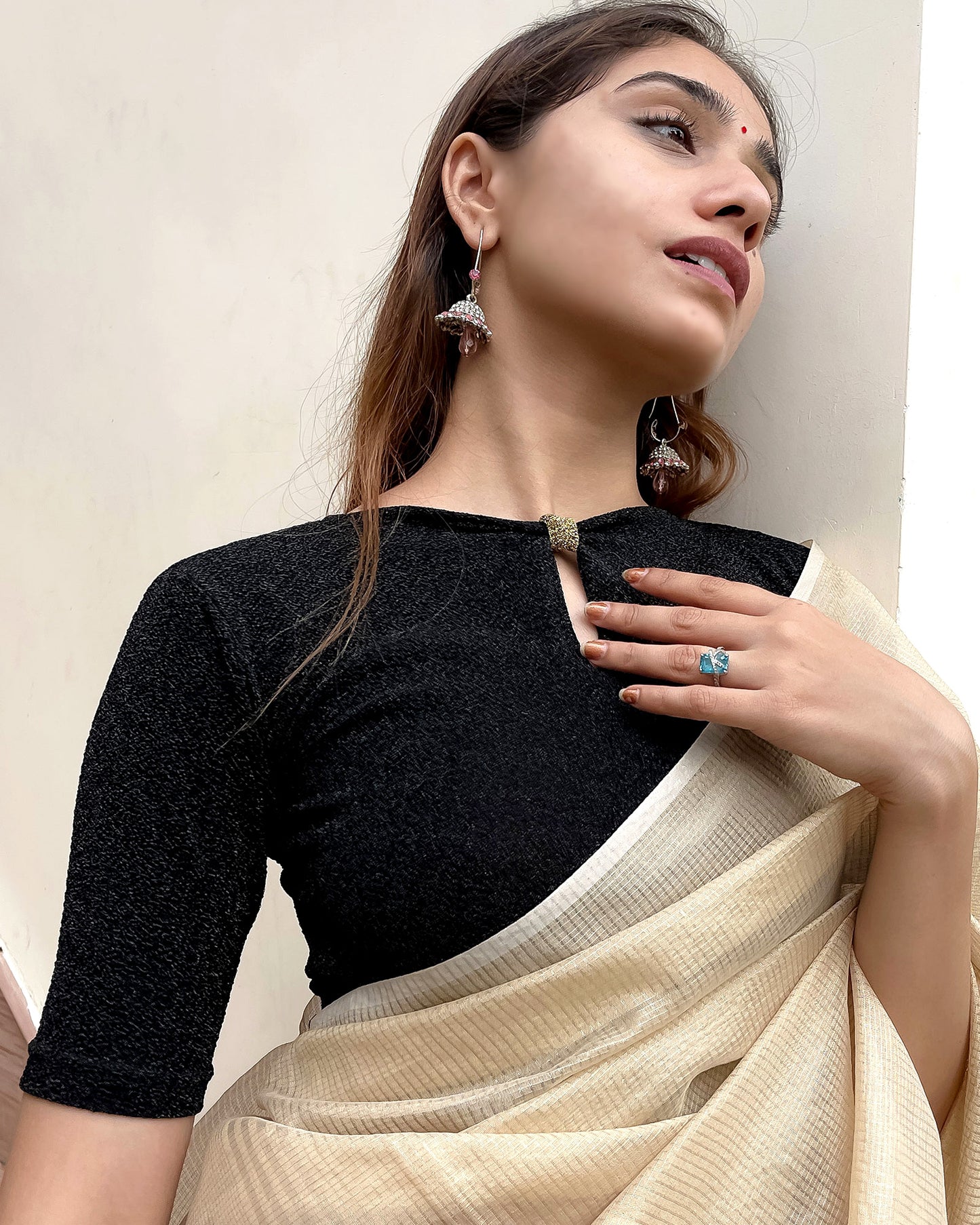 Model pairing the blouse with a saree for a chic festive look.
