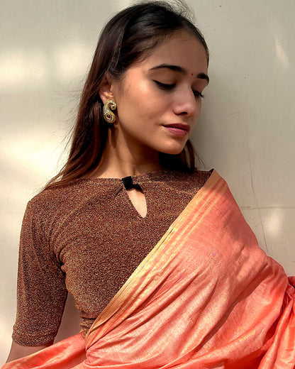 Model pairing the blouse with a saree for a chic festive look.