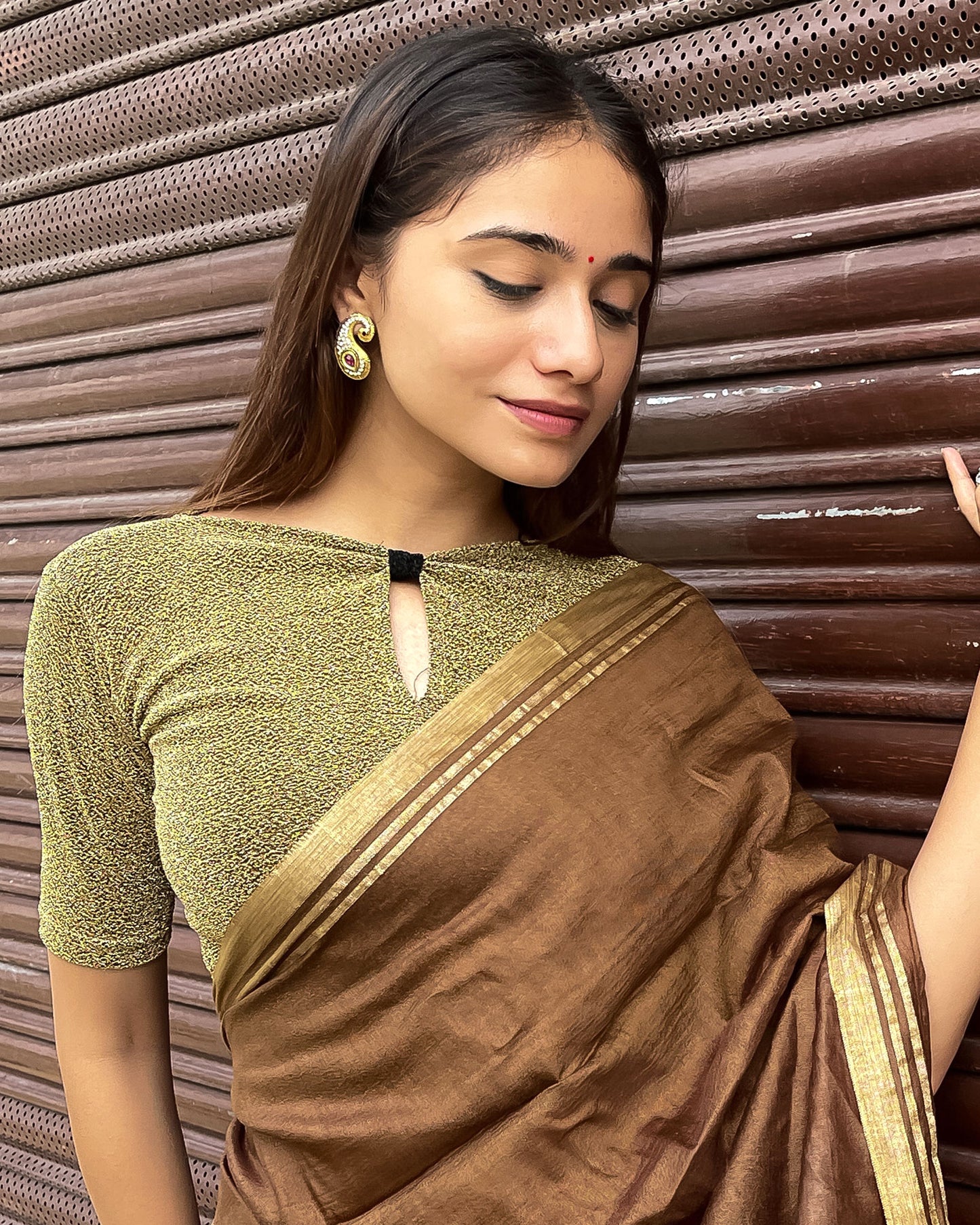 Model pairing the blouse with a saree for a chic festive look.