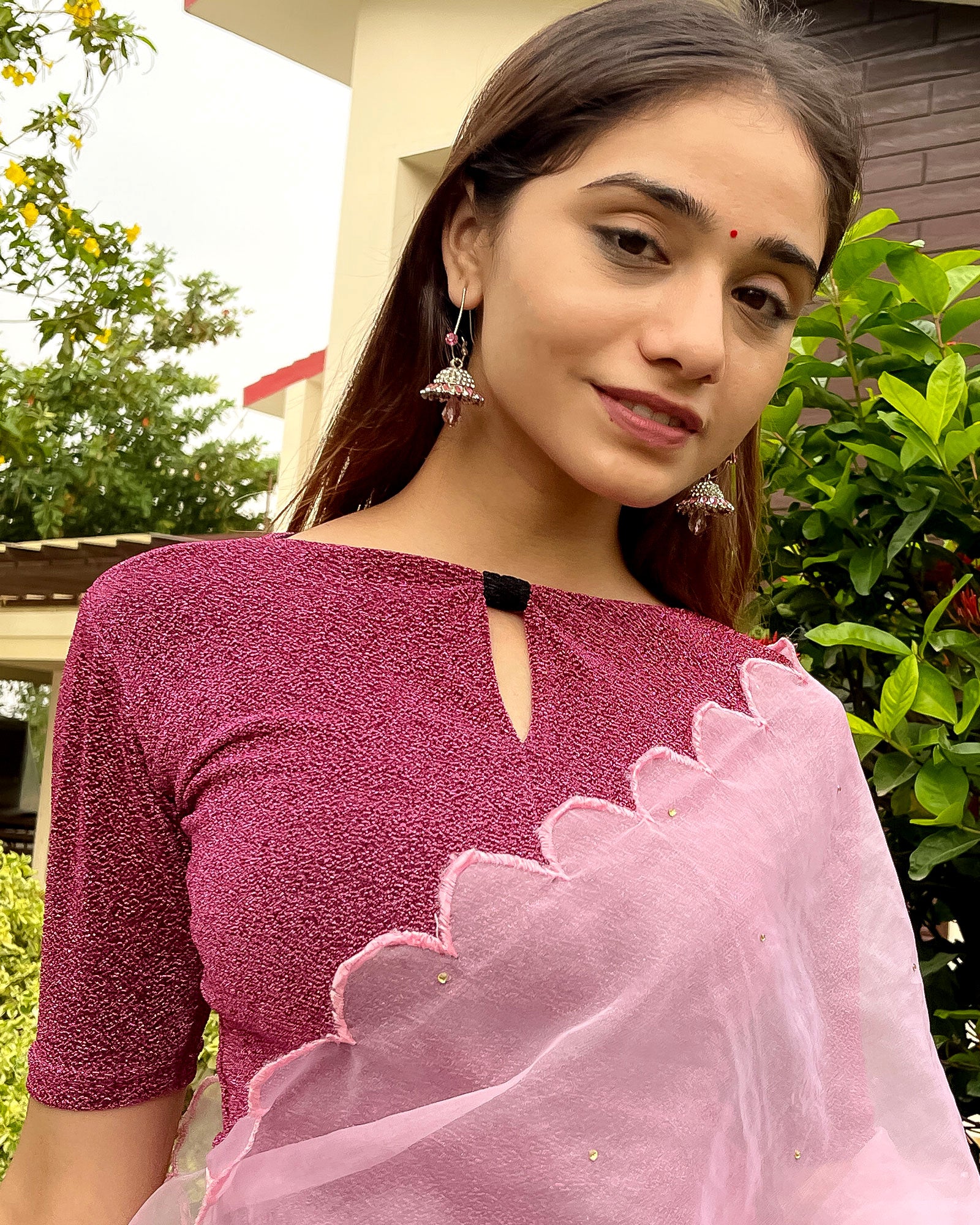 Model pairing the blouse with a saree for a chic festive look.