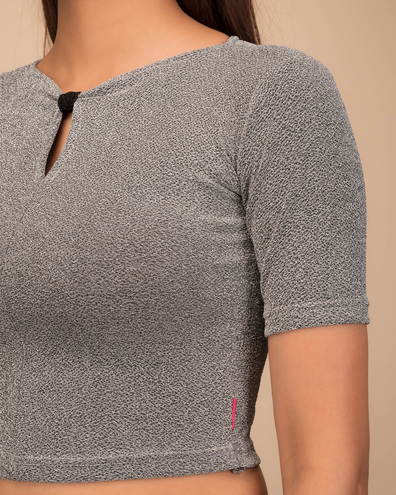 Close-up of the metallic knit texture and subtle zari lines.