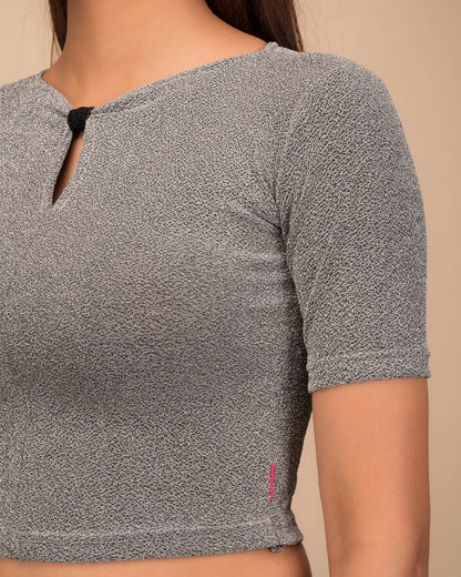 Close-up of the metallic knit texture and subtle zari lines.