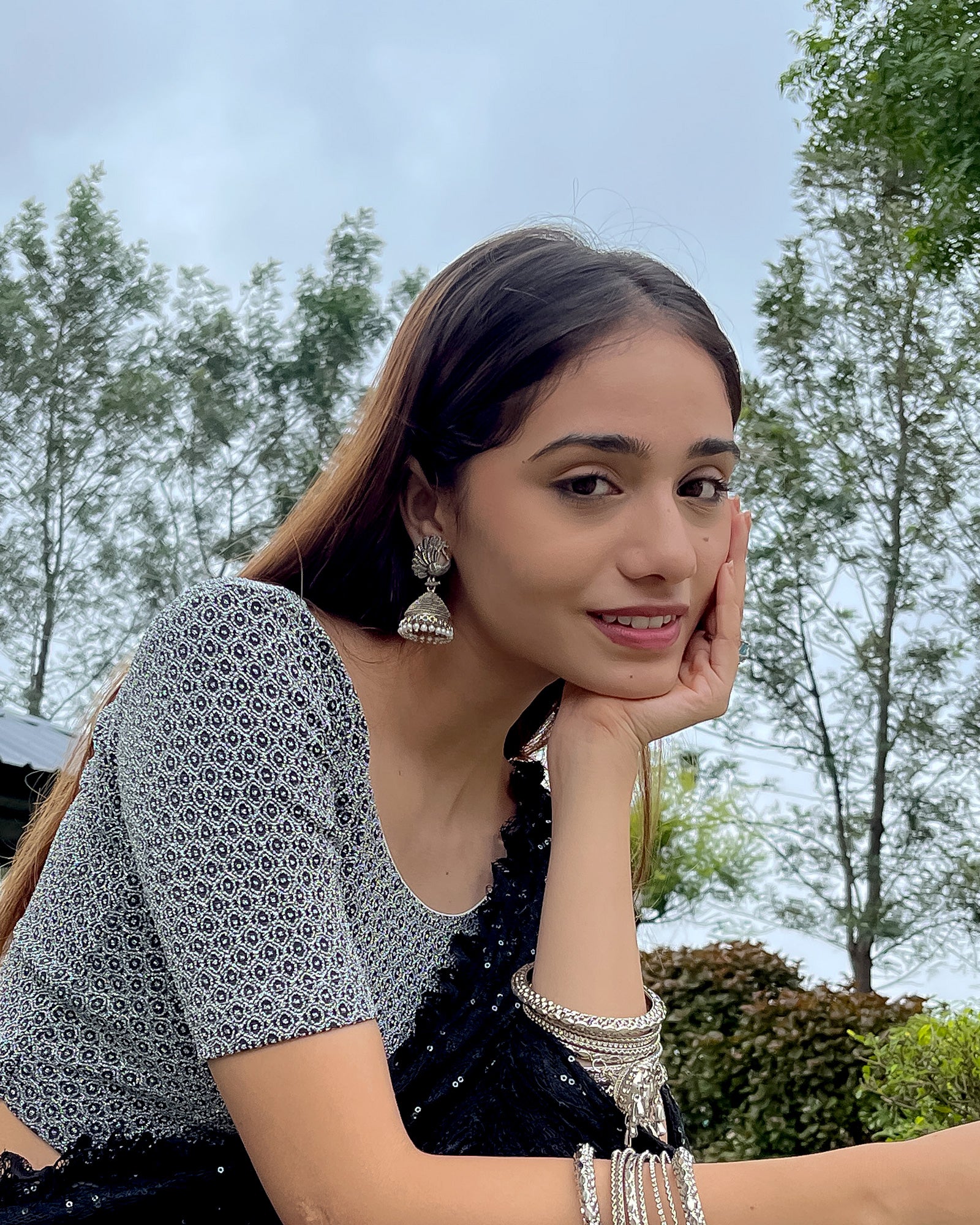 Model pairing the blouse with a luxurious saree for a festive look.