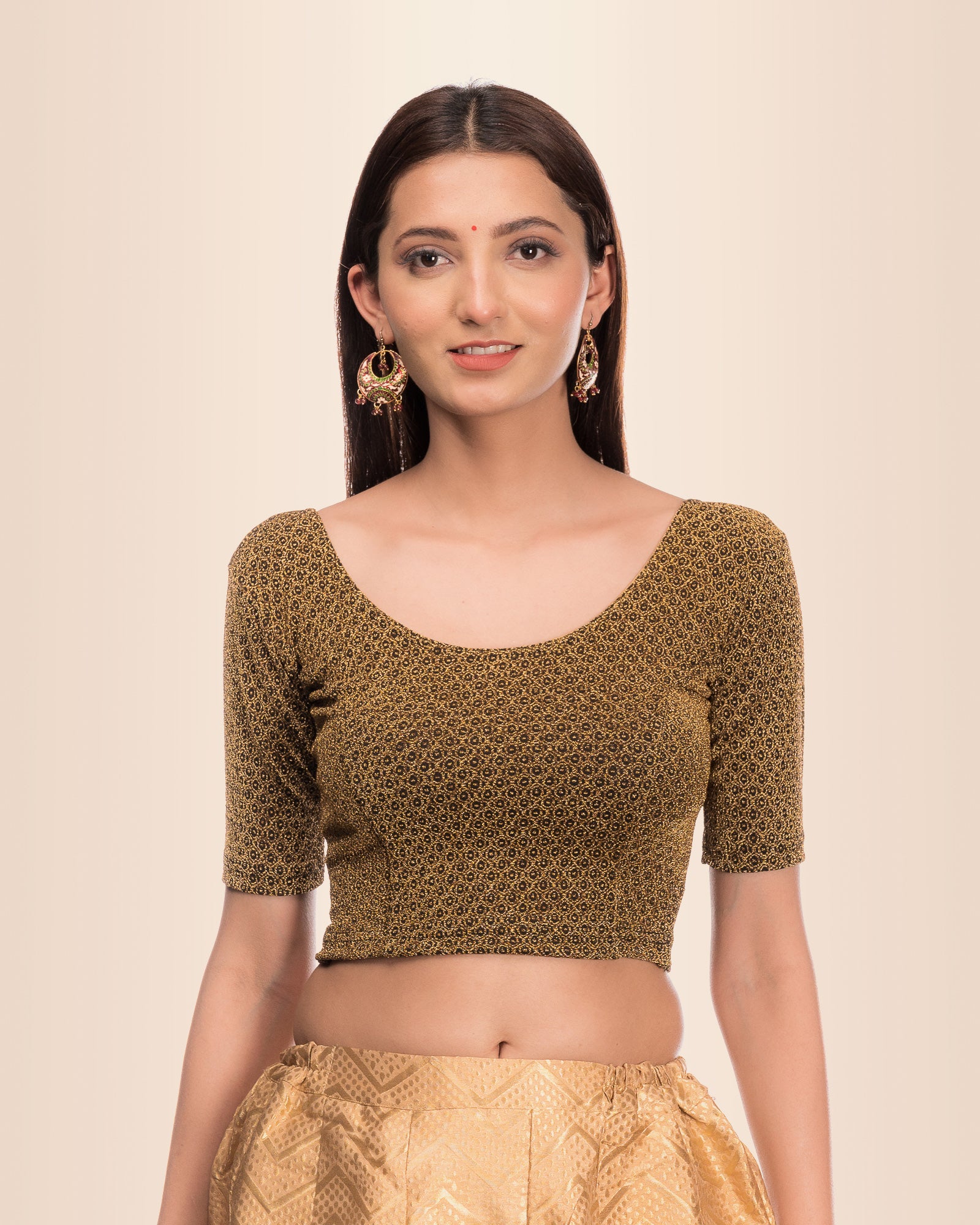 Model wearing a stretchable blouse with metallic zig-zag zari stripes, round neckline, and elbow sleeves