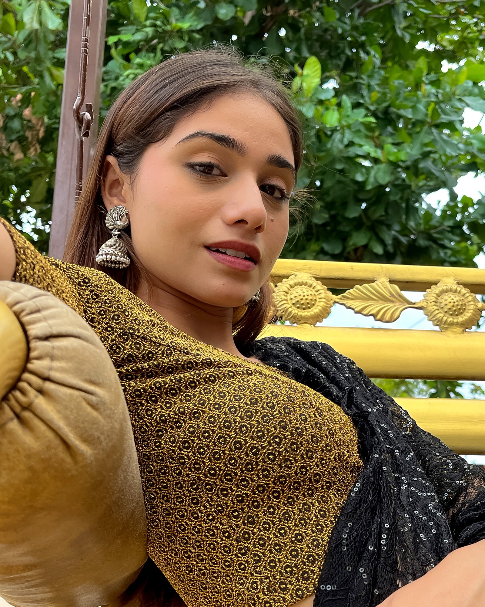 Model pairing the blouse with a luxurious saree for a festive look.