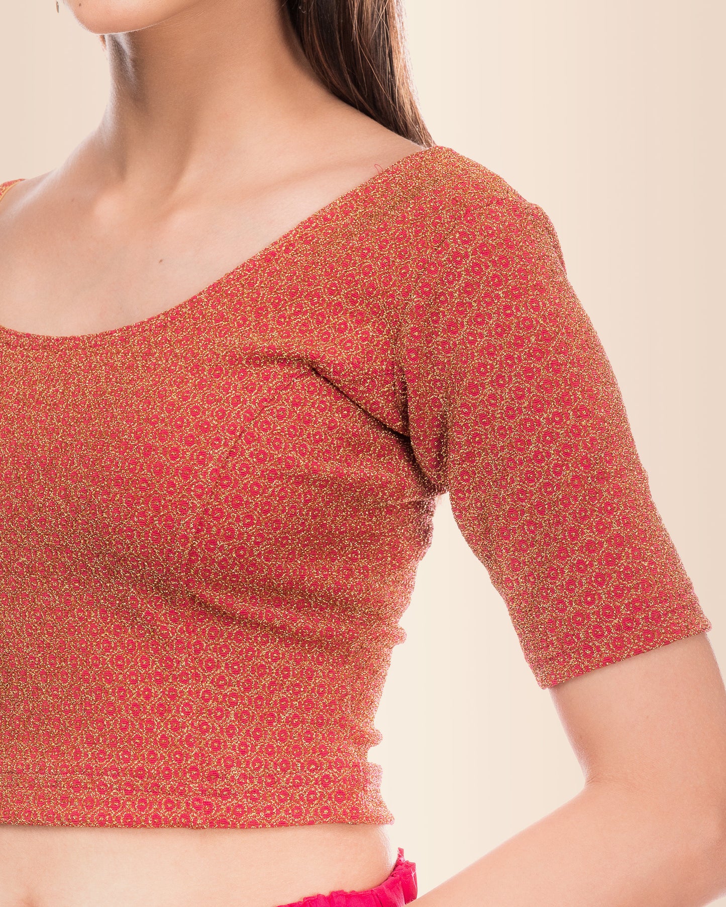 Close-up of the knit fabric featuring metallic zari stripe detailing