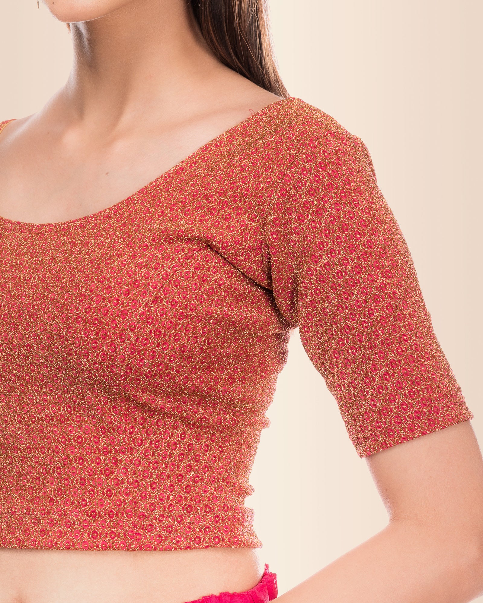 Close-up of the knit fabric featuring metallic zari stripe detailing