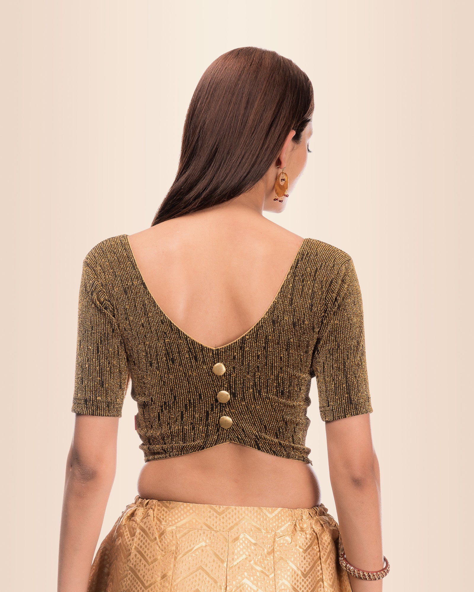 Rear view showing the button-placket back design.