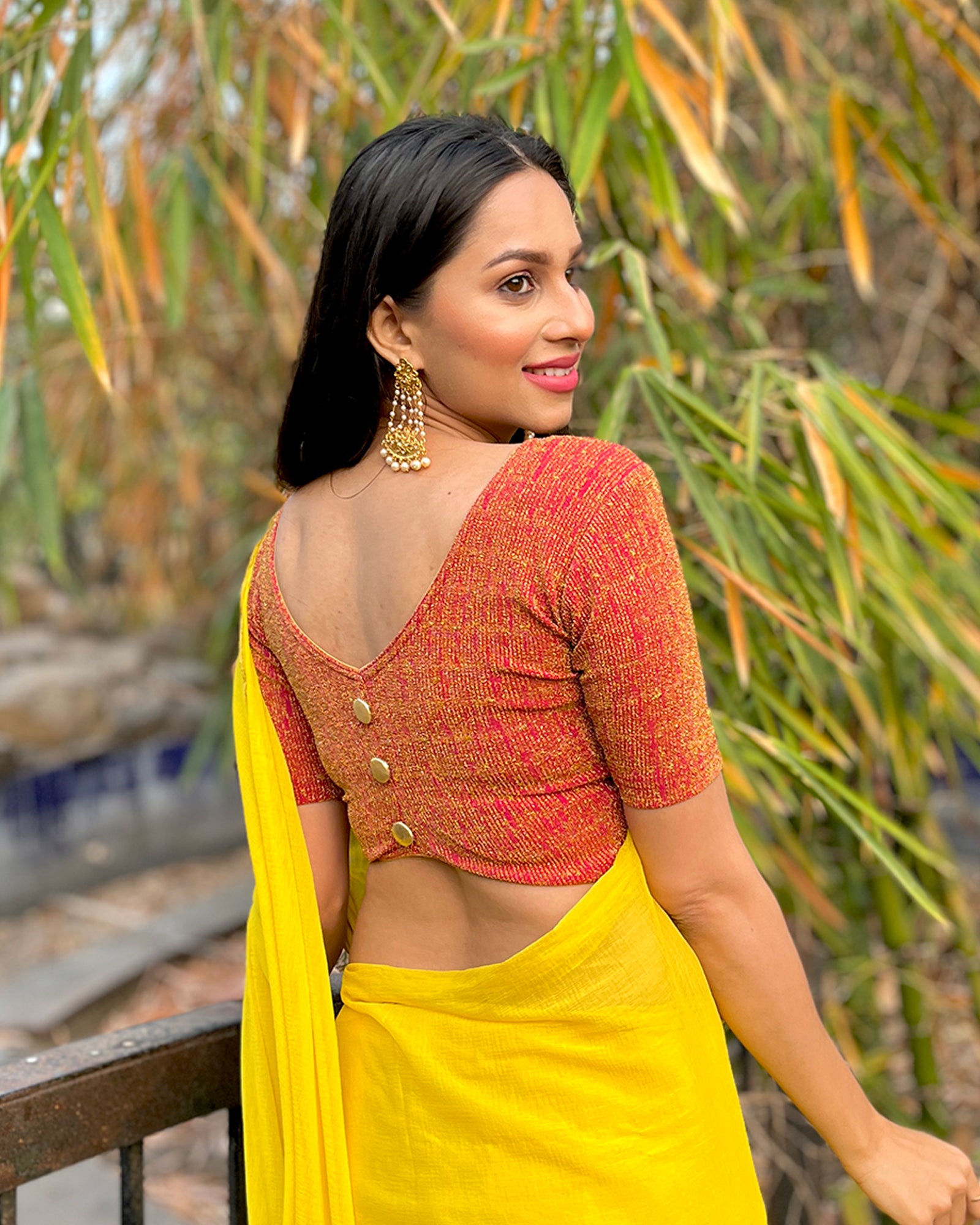Model pairing the blouse with a festive saree for an elevated ethnic look.