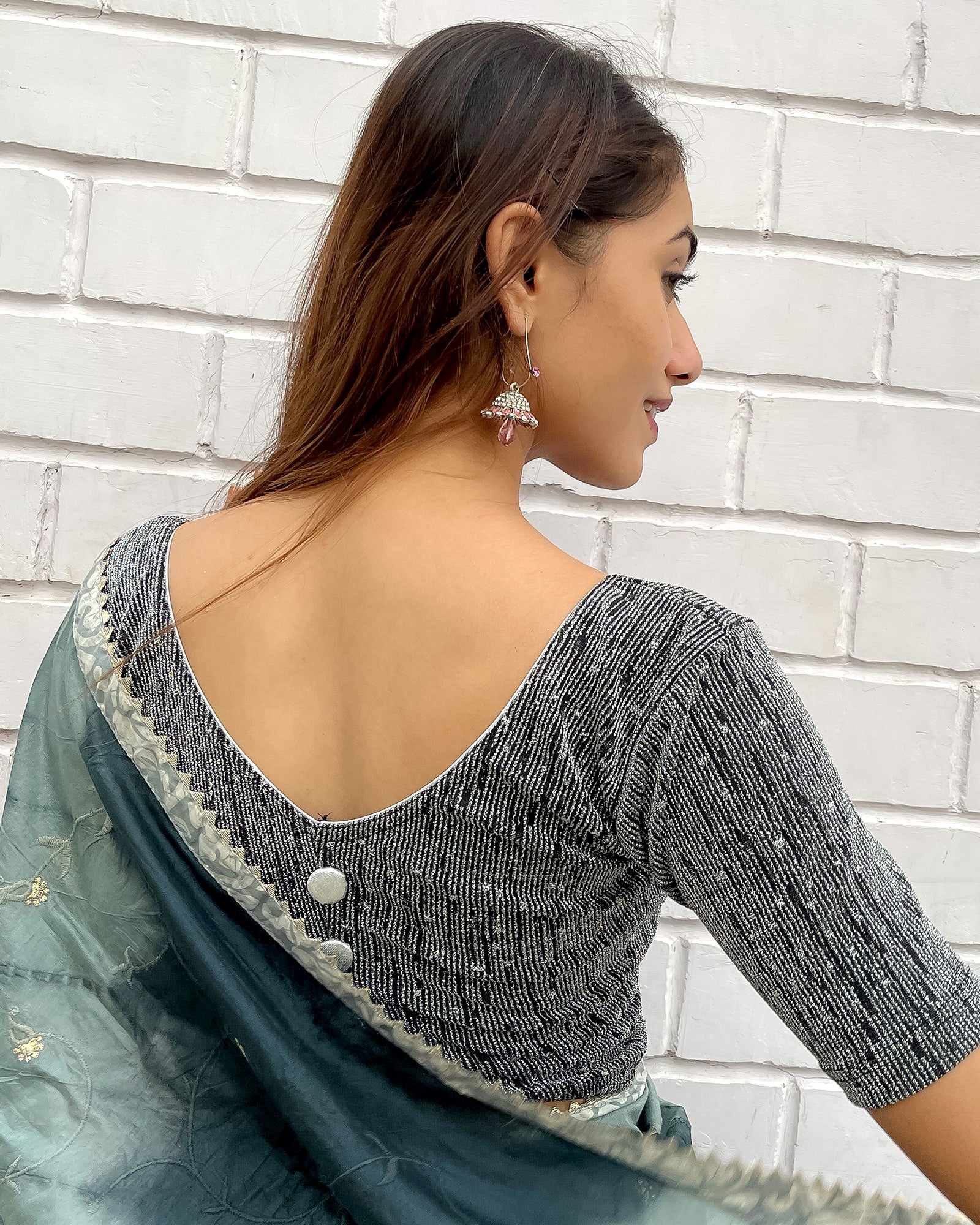 Model pairing the blouse with a festive saree for an elevated ethnic look.