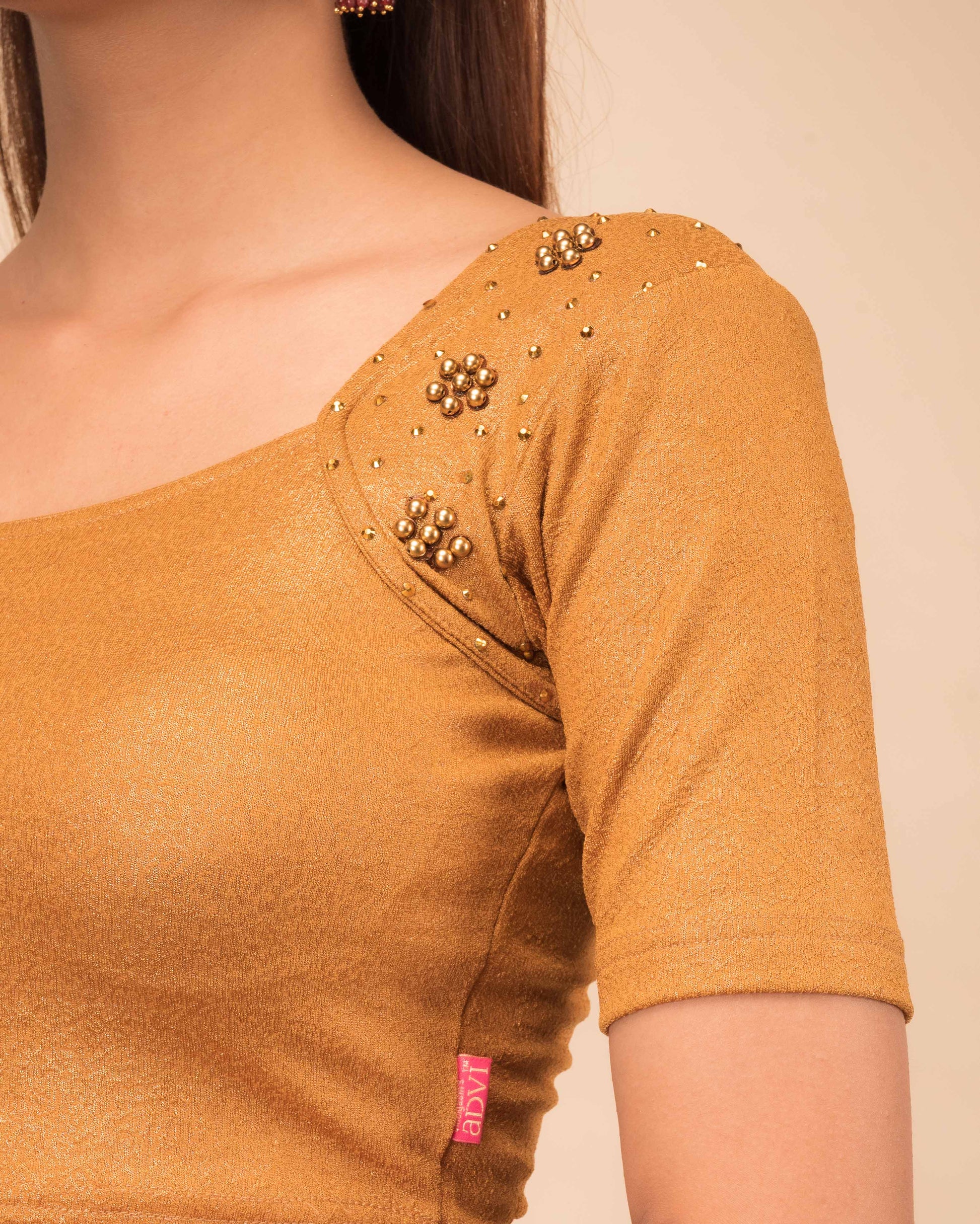 Close-up showcasing the metallic jacquard texture with pearl-sequin work.