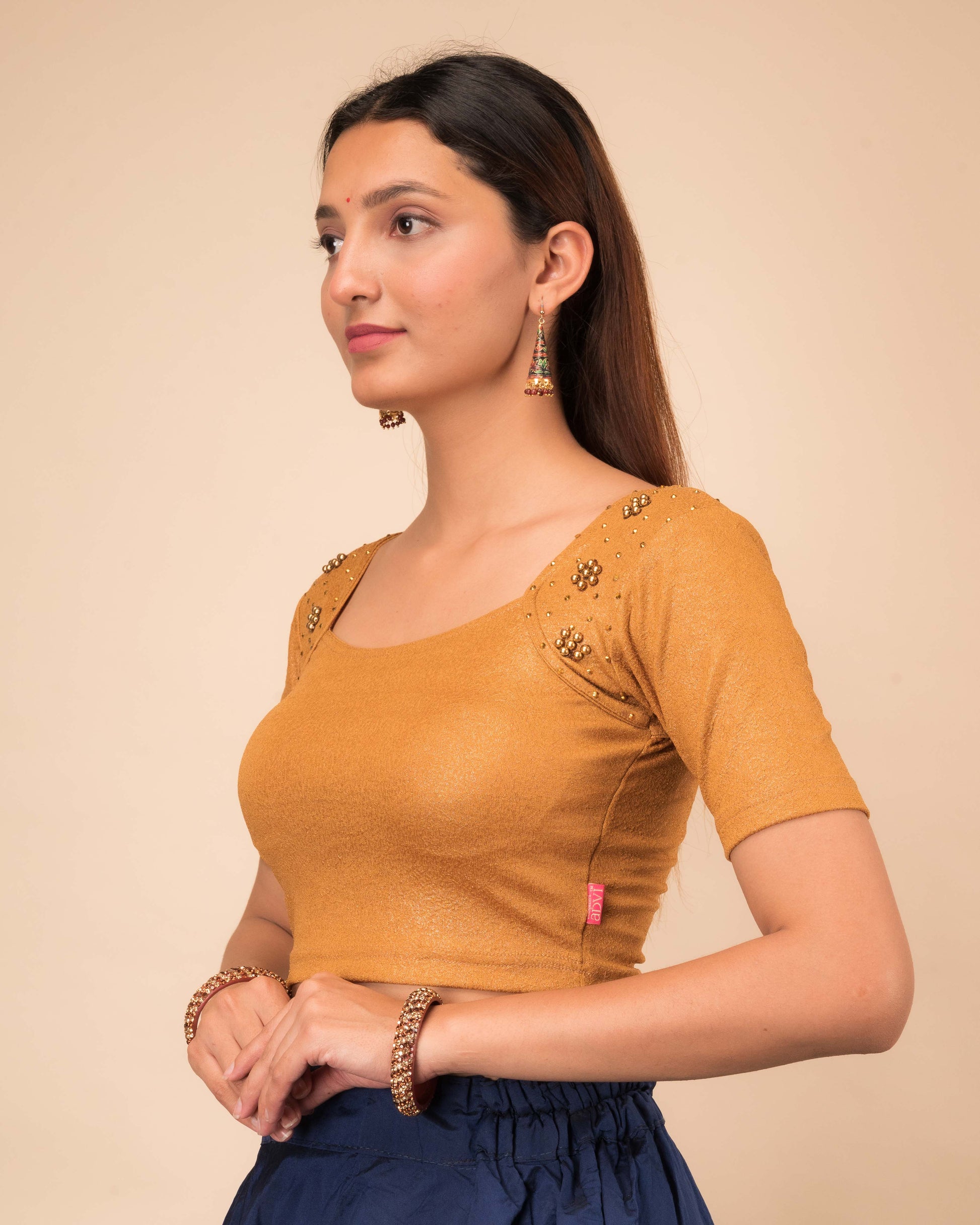 Side profile highlighting the shoulder accents and sleeve silhouette.