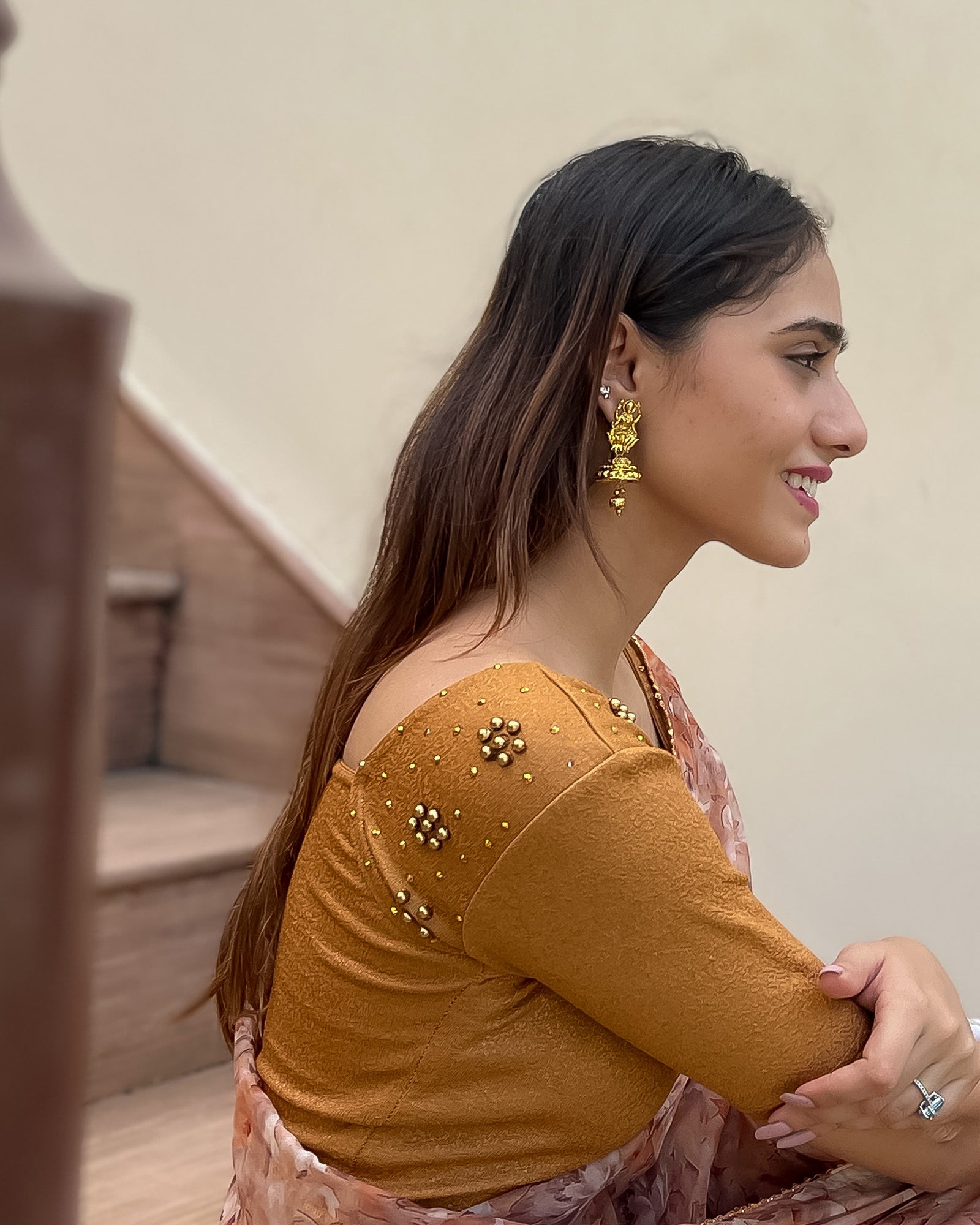 Model styled with a saree for an elegant, festive ensemble.