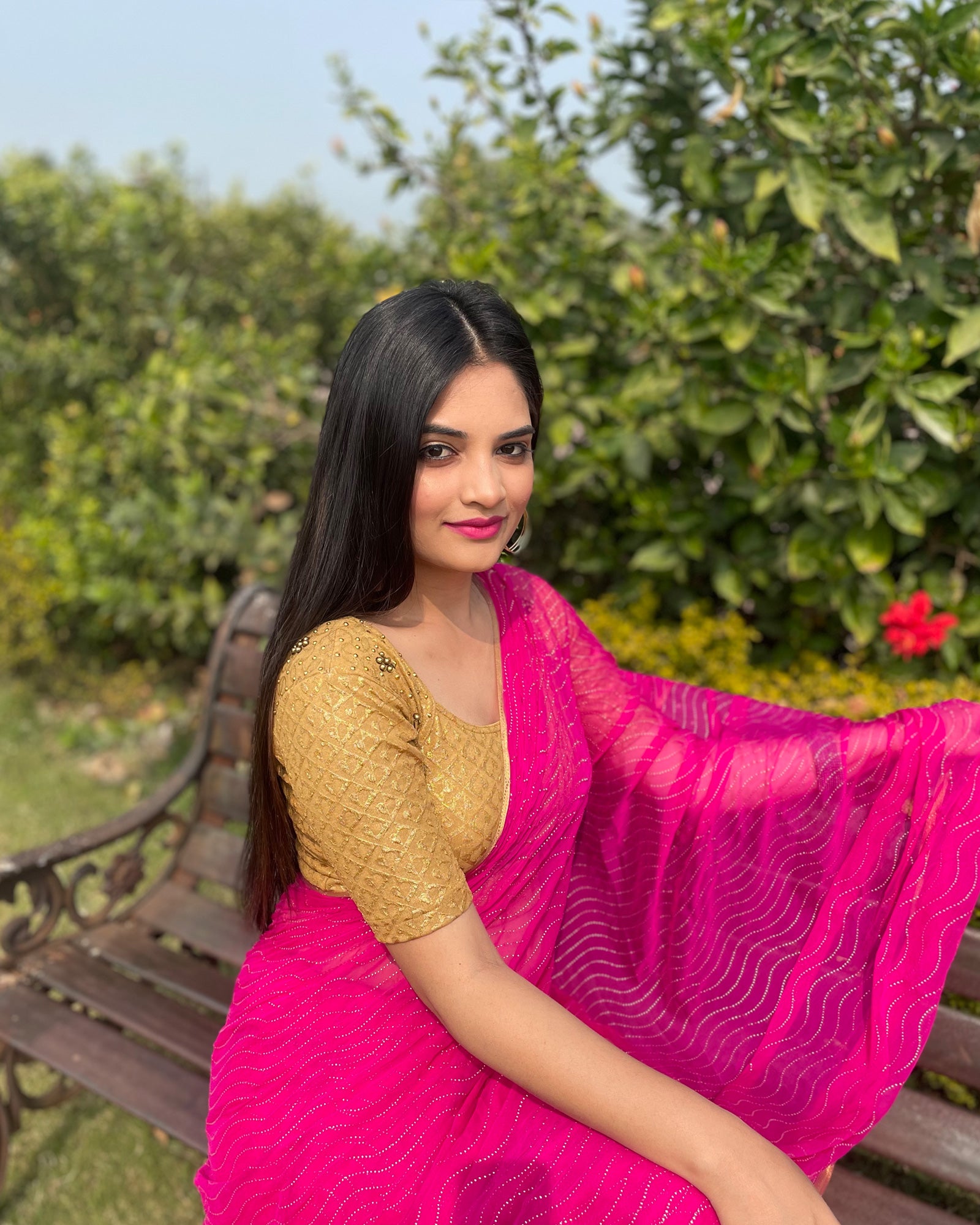 Model styled with a saree for an elegant, festive ensemble.