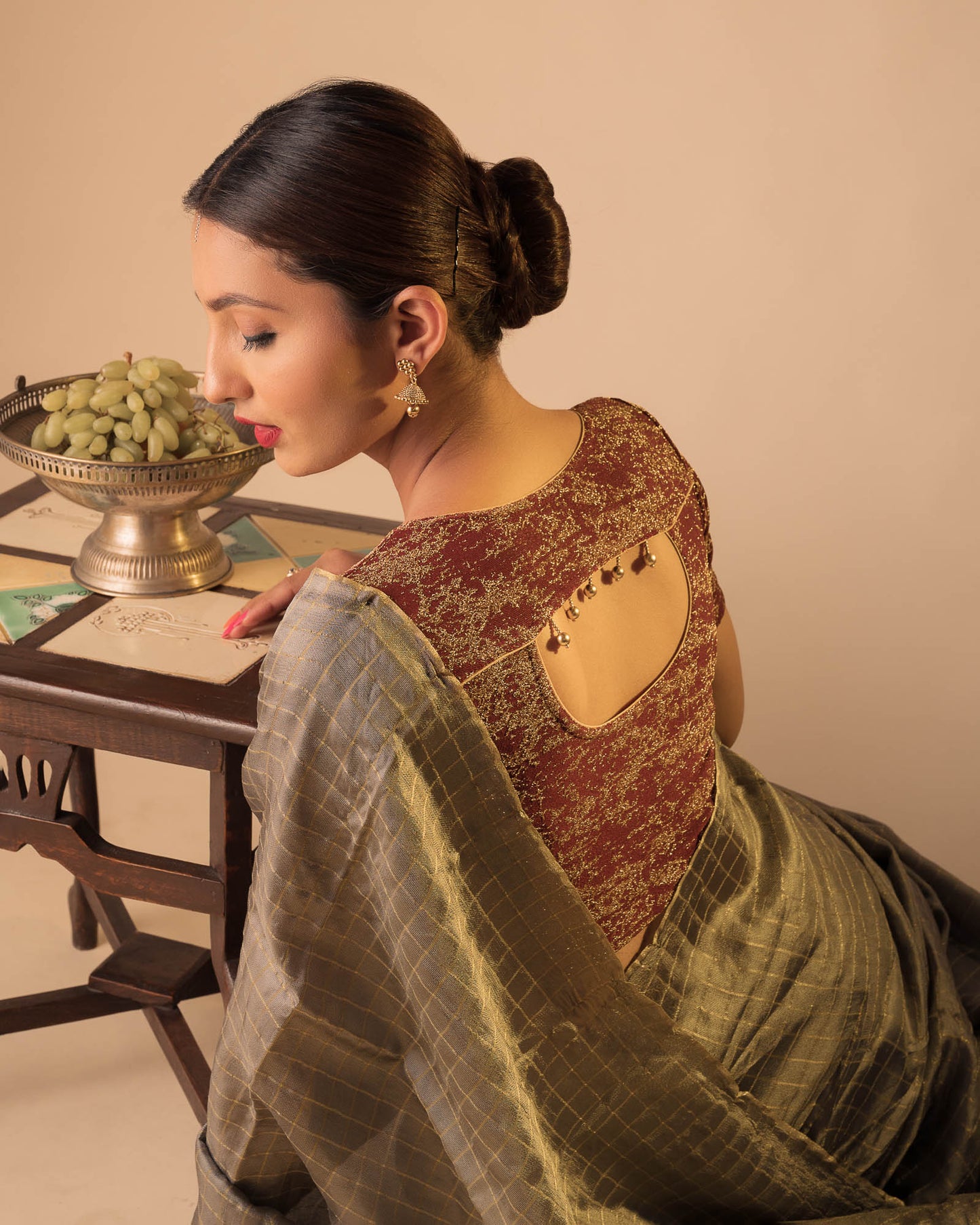 Model pairing the blouse with an ethnic saree and lehenga to highlight the latkan detailing