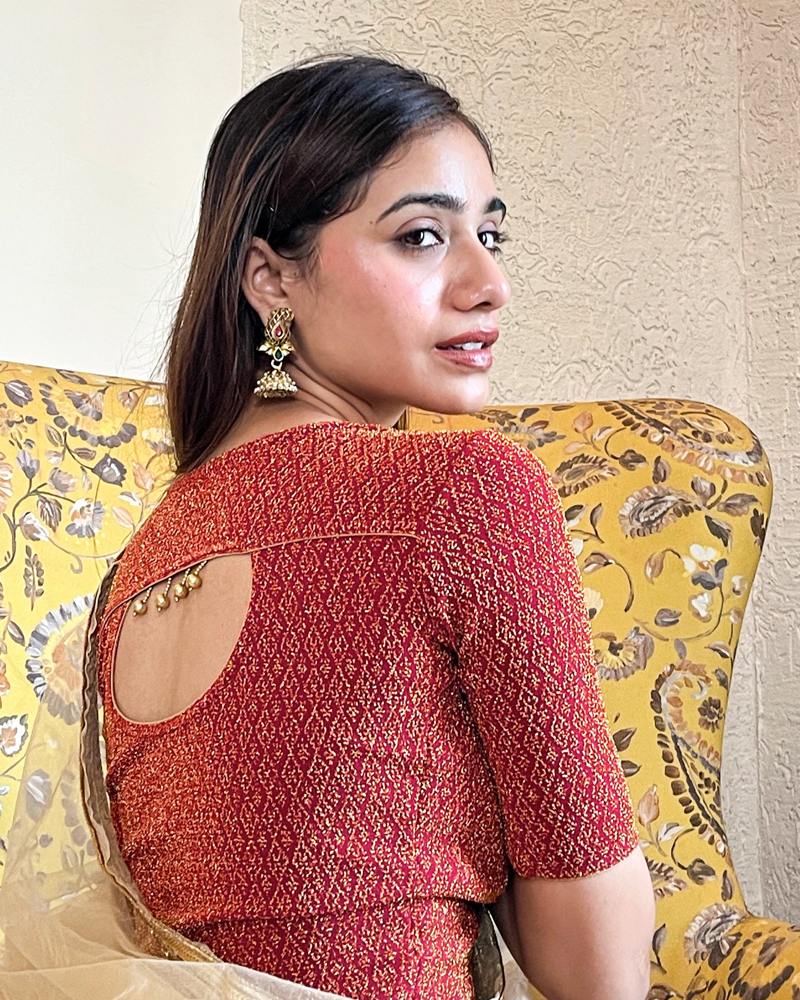 Model pairing the blouse with an ethnic saree and lehenga to highlight the latkan detailing