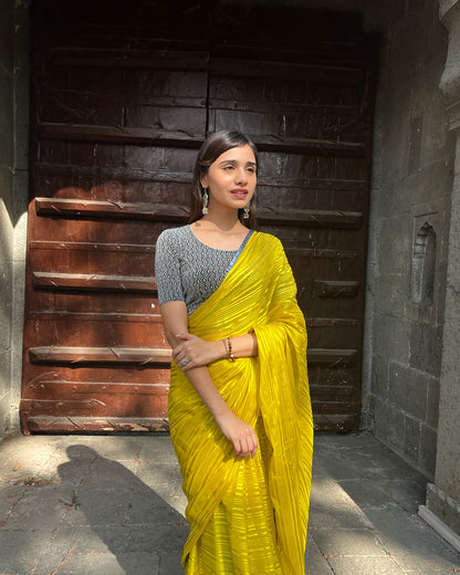 Model pairing the blouse with an ethnic saree and lehenga to highlight the latkan detailing