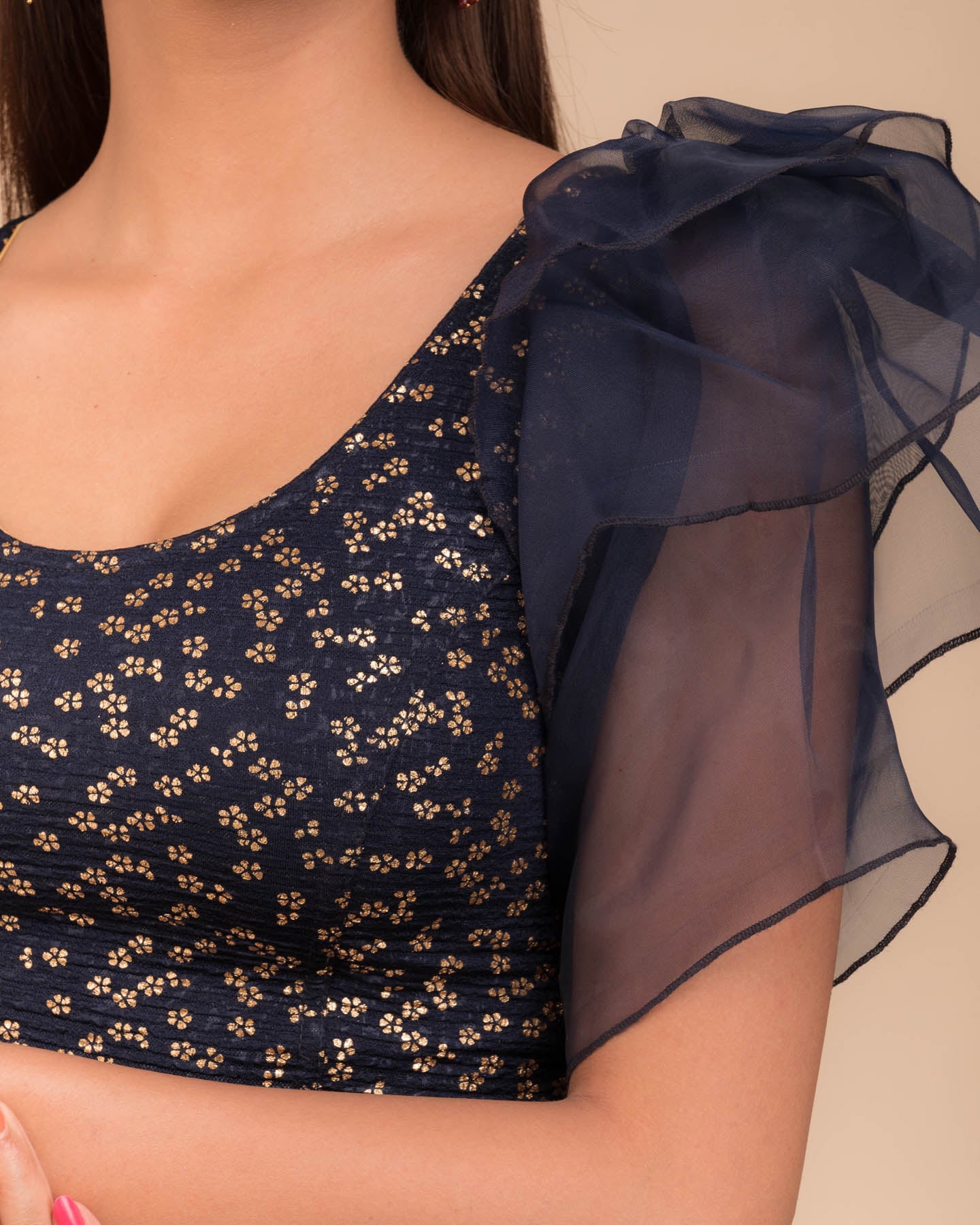 Close-up of the foil floral print on organza in lightweight stretch texture