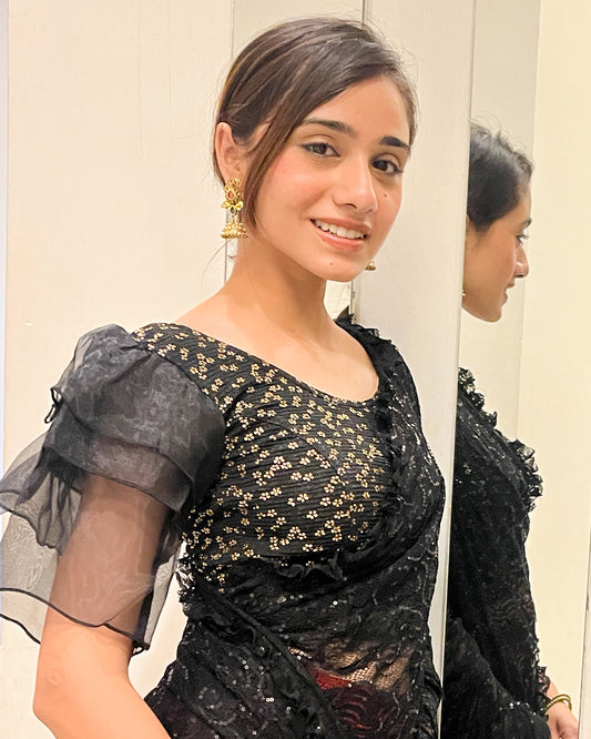 Model pairing the blouse with a saree for a festive, elegant look
