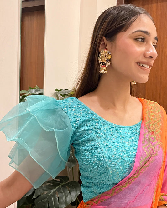 Model pairing the blouse with a saree for a festive, elegant look