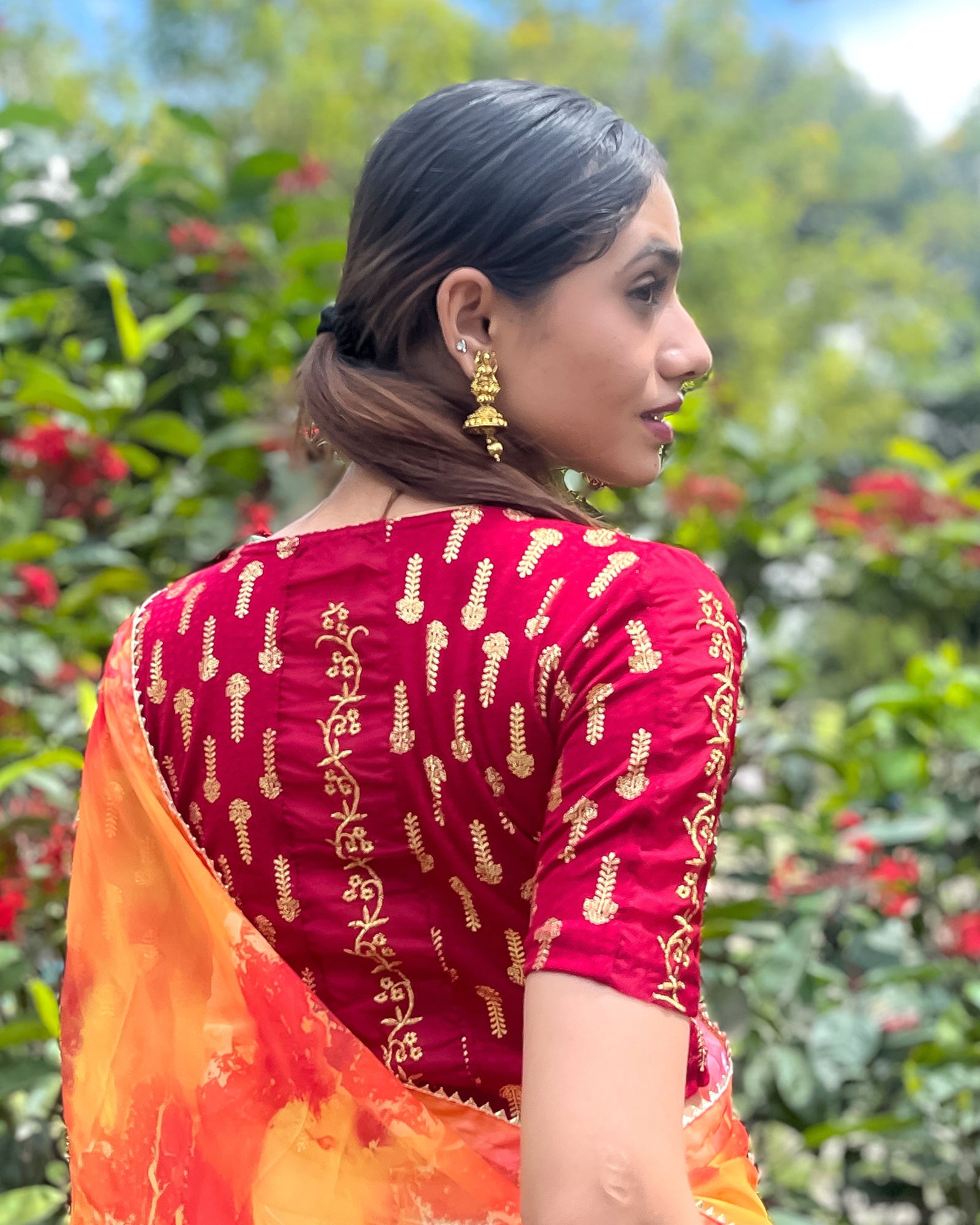 Model pairing the blouse with a saree for a festive look