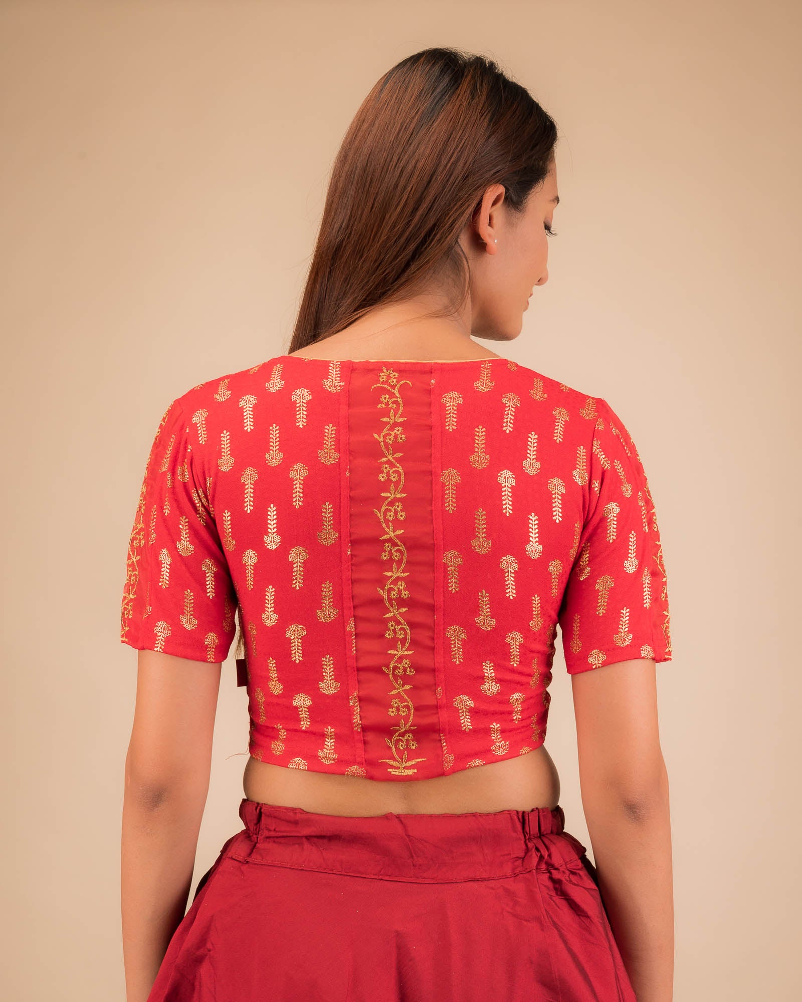 Rear view showcasing the embroidered zig-zag pattern across the back.