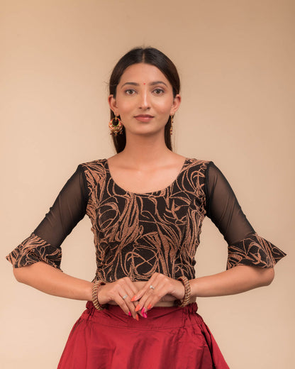 Model wearing a stretchable blouse featuring tonal zari flower appliqués, round neckline, and elbow sleeves