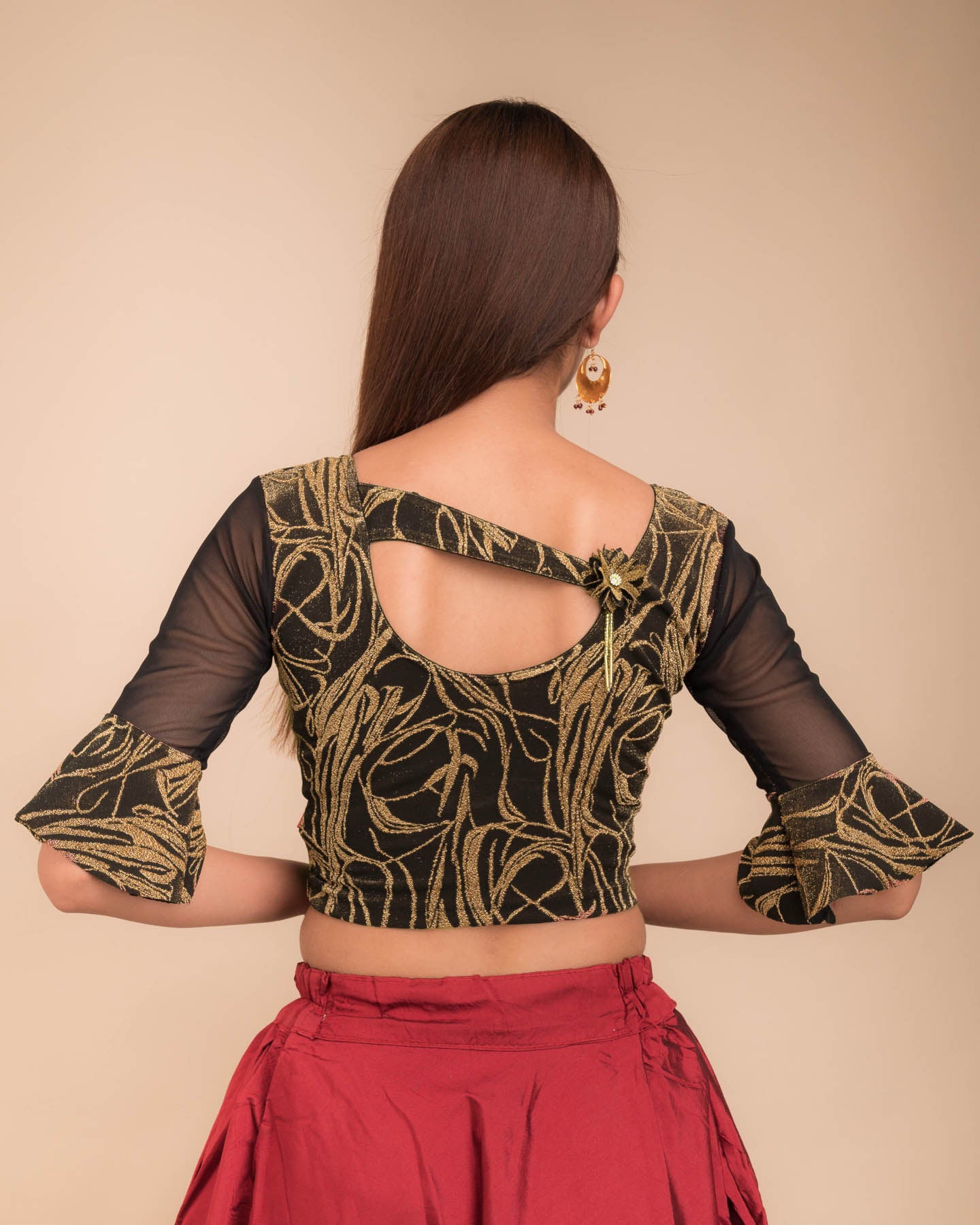  Rear view showcasing the appliqué detailing and back fit.