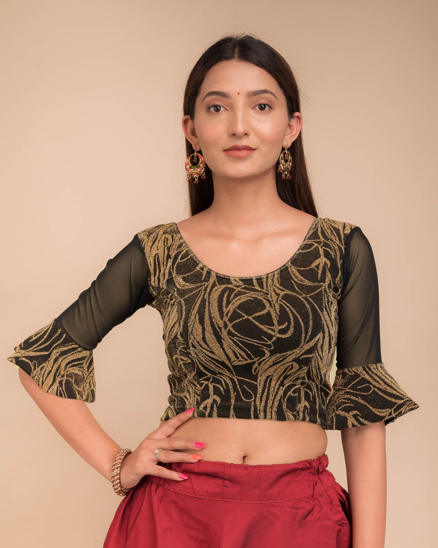 Model wearing a stretchable blouse featuring tonal zari flower appliqués, round neckline, and elbow sleeves