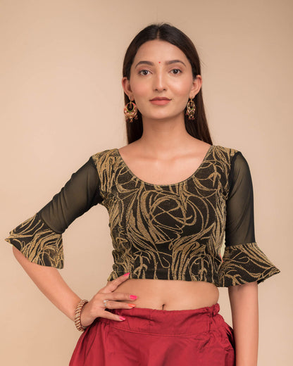 Model wearing a stretchable blouse featuring tonal zari flower appliqués, round neckline, and elbow sleeves