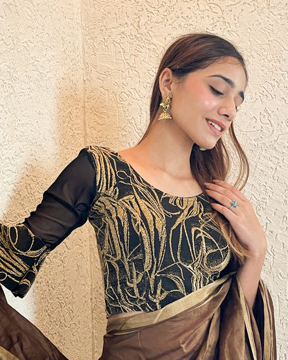 Model pairing the blouse with a saree for an elegant festive ensemble
